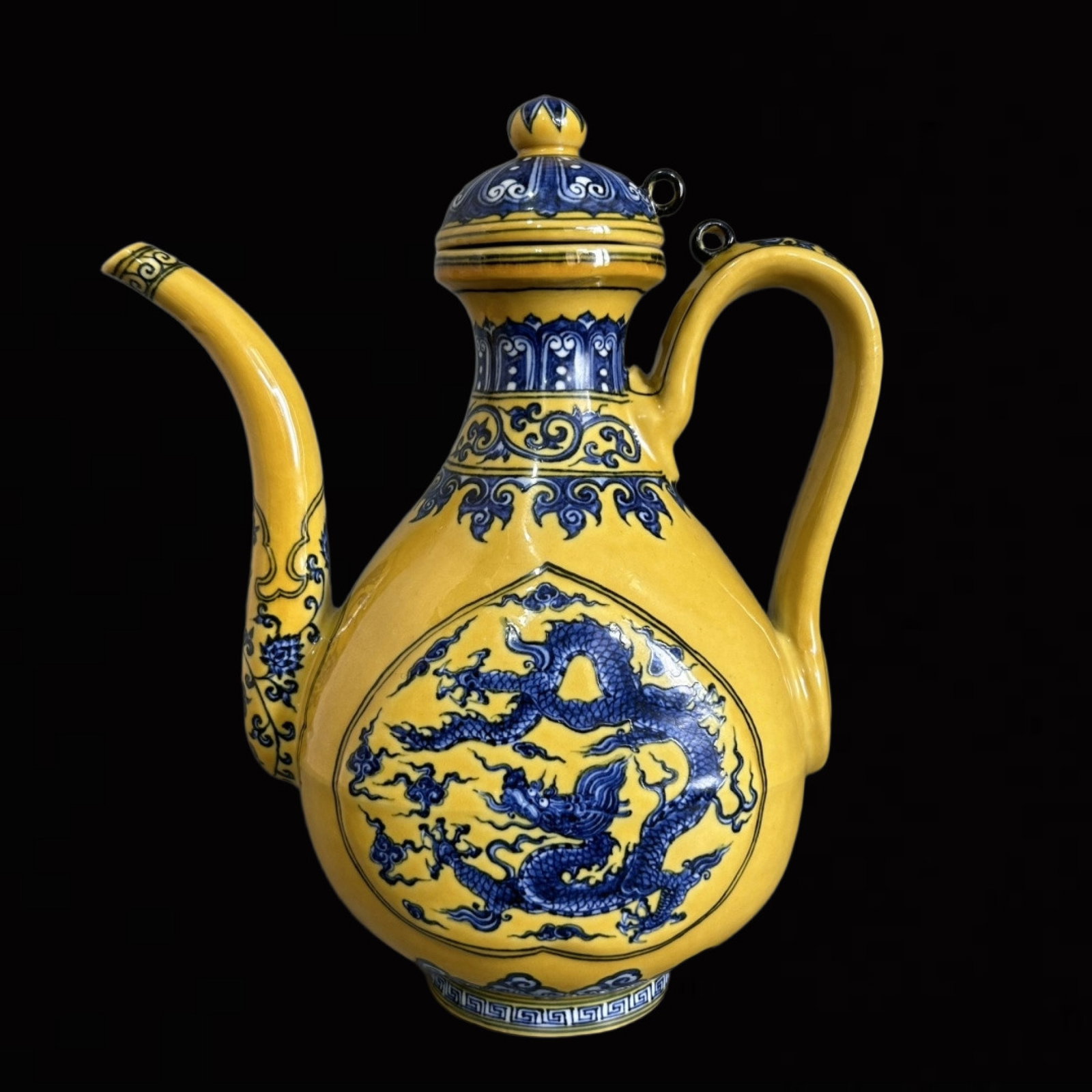 An Exquisite Yellow Ground Blue and White Auspicious Cloud and Dragon Pattern Ewer: An Exquisite Yellow Ground Blue and White Auspicious Cloud and Dragon Pattern Ewer,Qing Dynasty,China,Size:6.7inx9.2in 黄地青花祥云龙纹执壶,