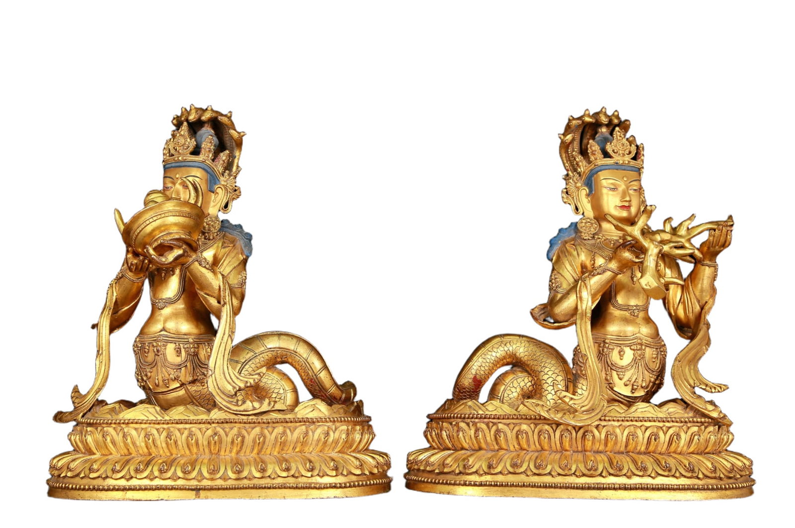 A stunning pair of gilt bronze statues of Bodhisattva: A pair of shocking gilt bronze statues of Bodhisattva,Ming Dynasty, China, with graceful and serene postures. His face is solemn and kind, and his eyes are deep, as if he can see into the suffering of