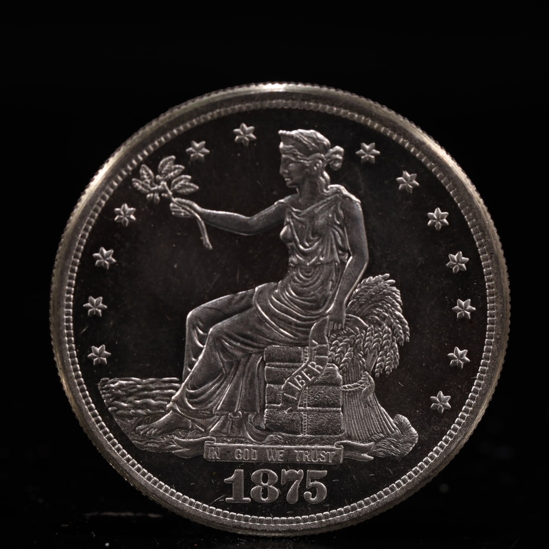 USA Trade Dollar 1875 Coin: American coin. Obverse: Liberty seated on a pedestal facing the sea to the left holding olive branches surrounded by 13 stars. IN GOD WE TRUST / LIBERTY / 1875. Reverse: An eagle holding branches with