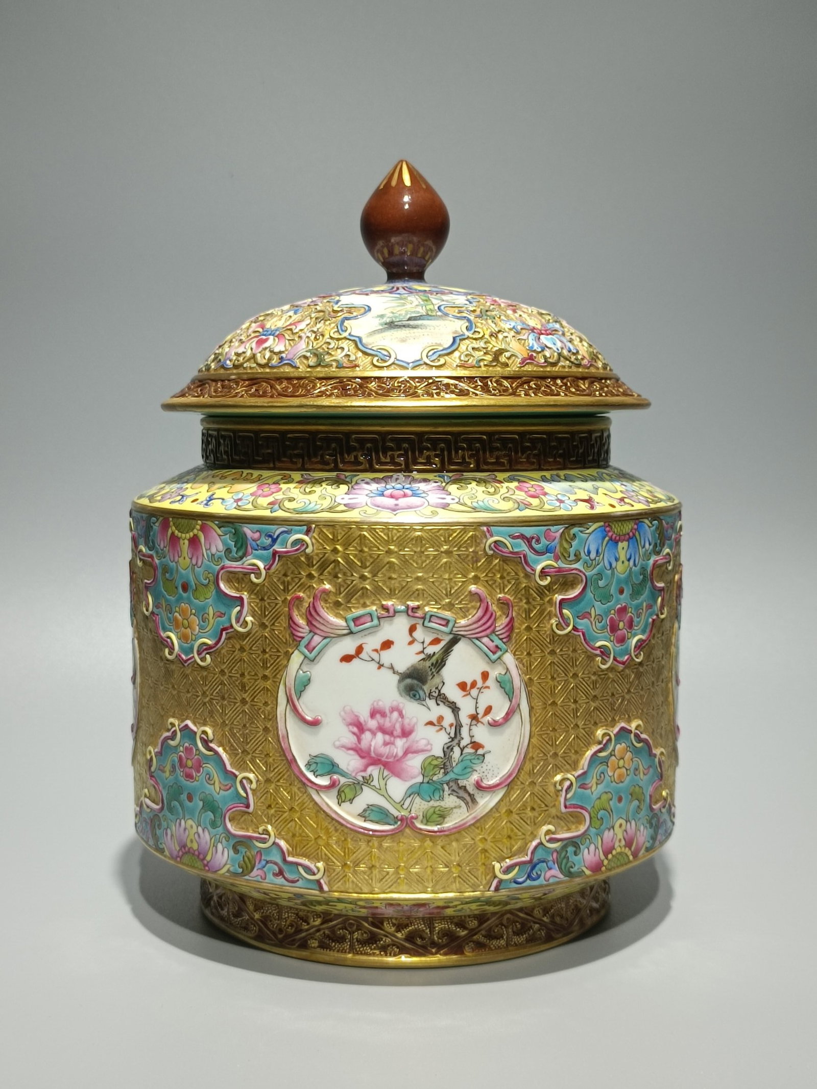 An Exquisite Enamel Gold Ground Flower and Bird Pattern Tea Caddy: An Exquisite Enamel Gold Ground Flower and Bird Pattern Tea Caddy,Qing Dynasty,China,Qianlong Six-character Mark,Size:8.3inx5.9in 珐琅彩金地花鸟纹ട