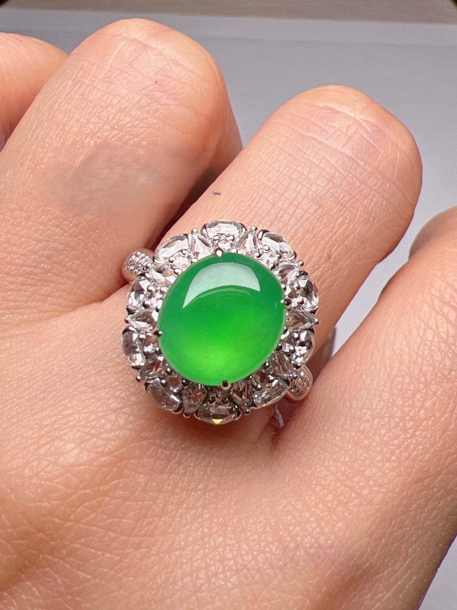 An Exquisite 18k Gold Diamond Inlaid Jadeite Ring: An Exquisite 18k Gold Diamond Inlaid Jadeite Ring,Size(Loose Stone):10mmx8.8mmx3.1mm #15 18k金钻镶嵌翡翠戒指