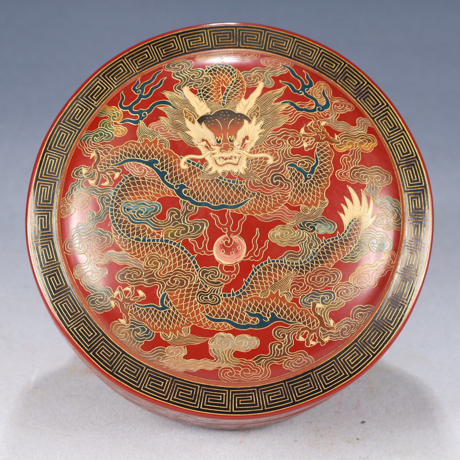 An Exquisite Carved Red Lacquer Painted Gold Lotus,Auspicious Cloud and Dragon Pattern Cover Box: An Exquisite Carved Red Lacquer Painted Gold Lotus,Auspicious Cloud and Dragon Pattern Cover Box,Qing Dynasty, China,Qianlong Six-character Mark,Size:6.7inx3.5in,Weight:300g 剔红漆&#
