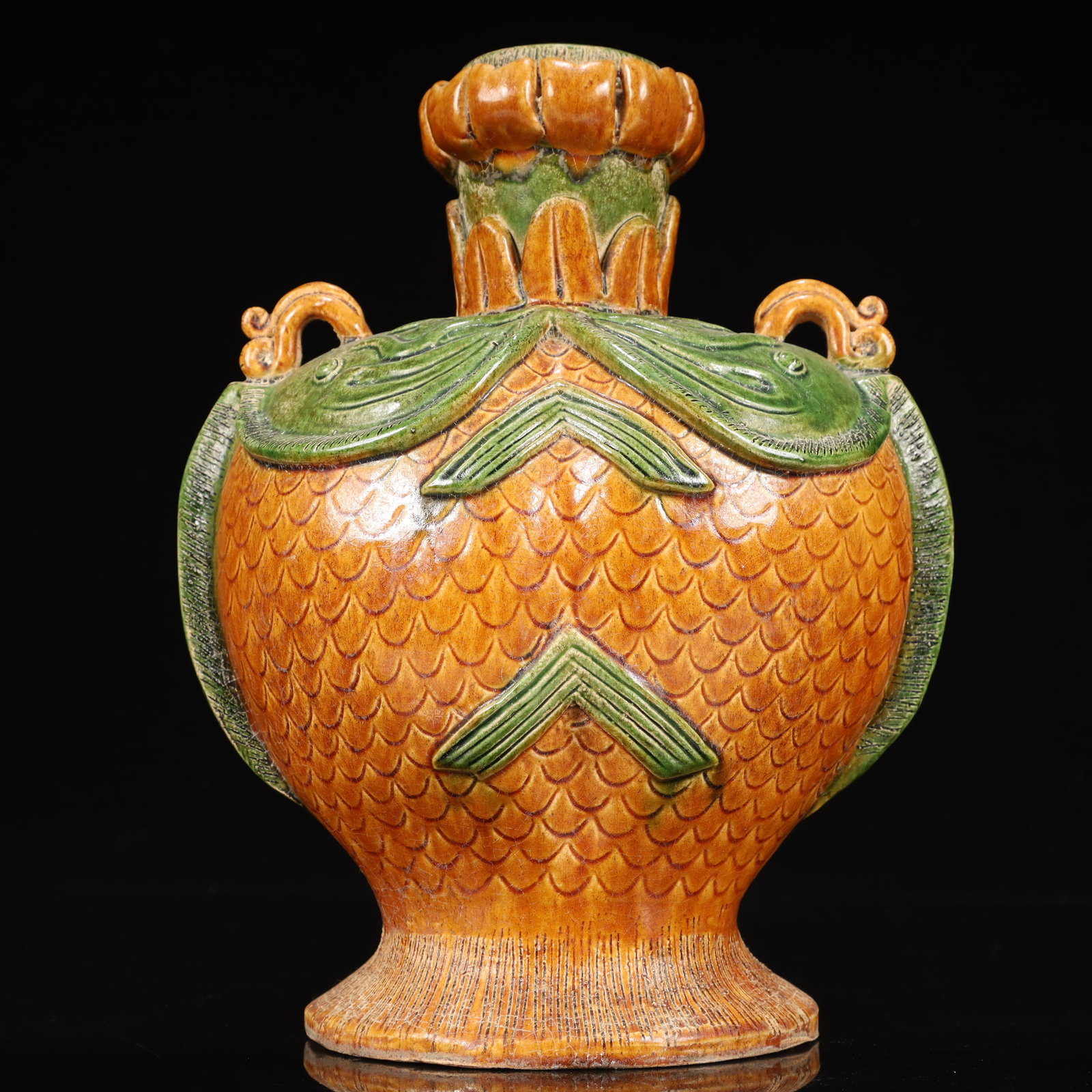 A Rare Tang Tri-Color Glazed Pottery Double Fish Pattern Vase: A Rare Tang Tri-Color Glazed Pottery Double Fish Pattern Vase,Tang Dynasty, China,Chinese Tang Tri-colored Pottery, or Tang Sancai, flourished during the Tang Dynasty (618–907 AD). It's renowned