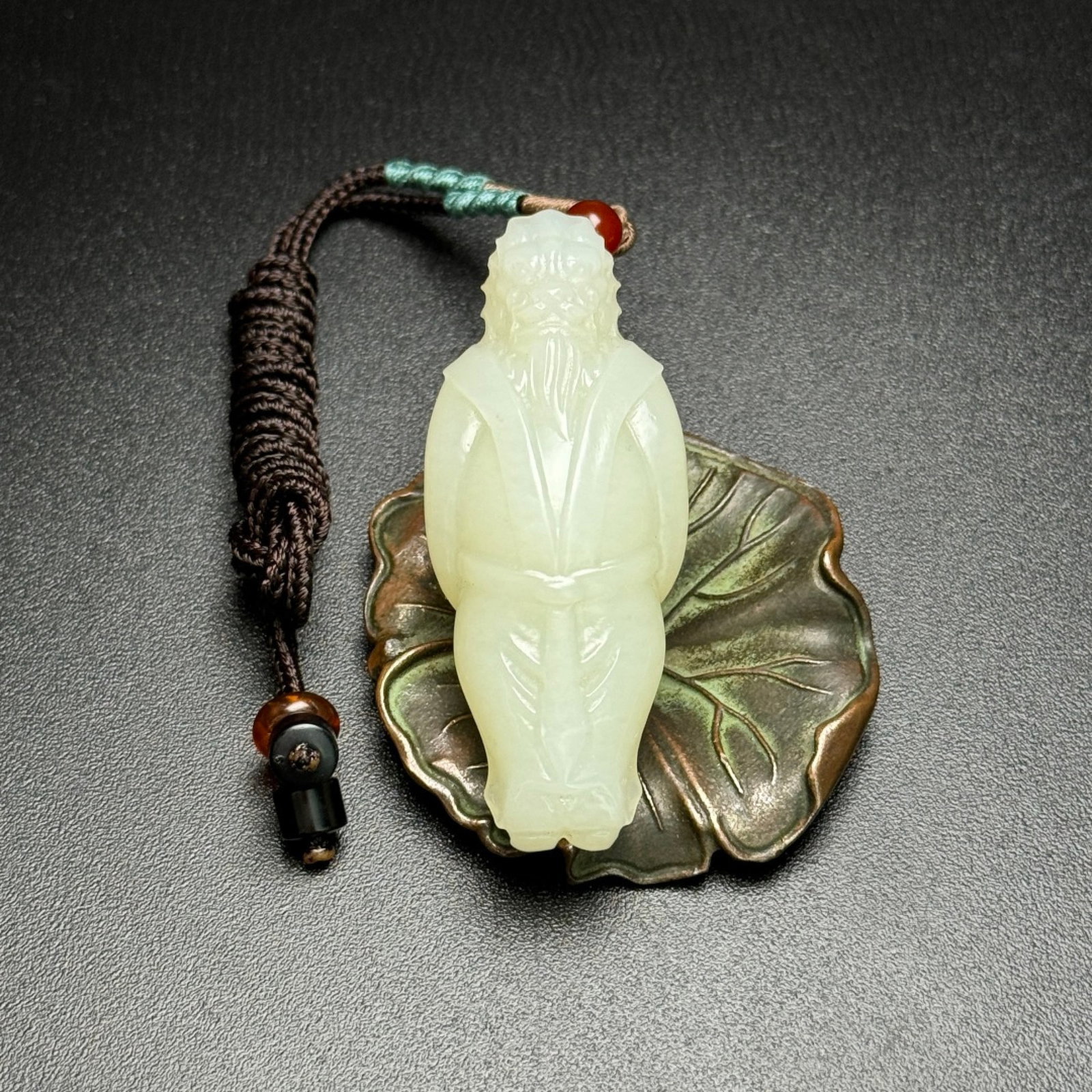An Exquisite White Jade Figure Pendant: An Exquisite White Jade Figure Pendant,Qing Dynasty,China,Size:24mmx59mmx16mm,Weight:30g 白玉人物挂件,中国清代