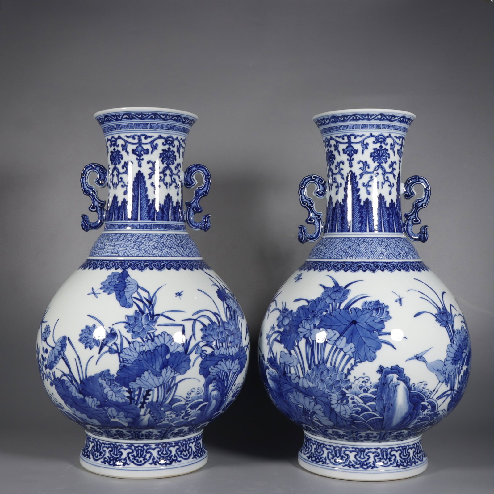 A Pair of Huge Blue and White Flower and Bird Pattern Double-Ears Vases: A Pair of Huge Blue and White Flower and Bird Pattern Double-Ears Vases,Qing Dynasty,China,Qianlong Six-character Mark,Size:17.7inx10.2in 一对青花花鸟纹ࡡ