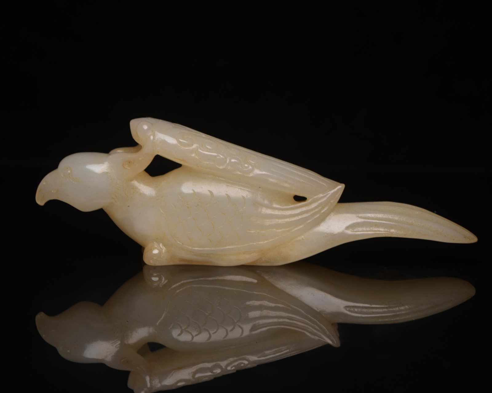 An Exquisite White Jade Phoenix Ornament: An Exquisite White Jade Phoenix Ornament,Qing Dynasty,China,Size:4.7inx1.6inx0.8in,Weight:117g 白玉凤摆件,中国清代
