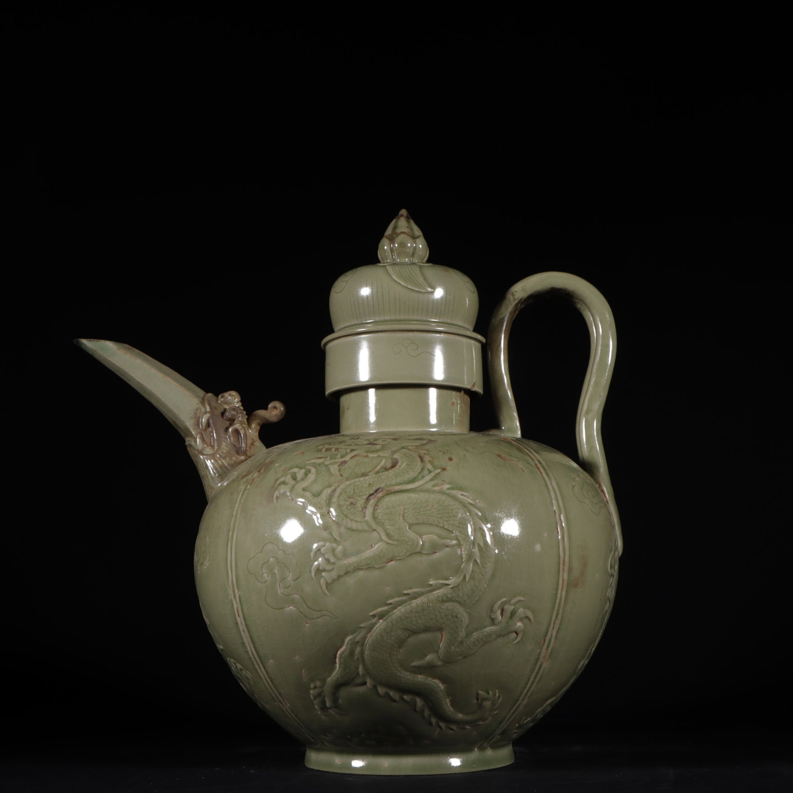 An Exquisite Yue yao Auspicious Cloud and Dragon Pattern Ewer: An Exquisite Yue yao Auspicious Cloud and Dragon Pattern Ewer,Tang Dynasty,China,Size:9.6inx9.4in 越窑祥云龙纹执壶,中国唐代