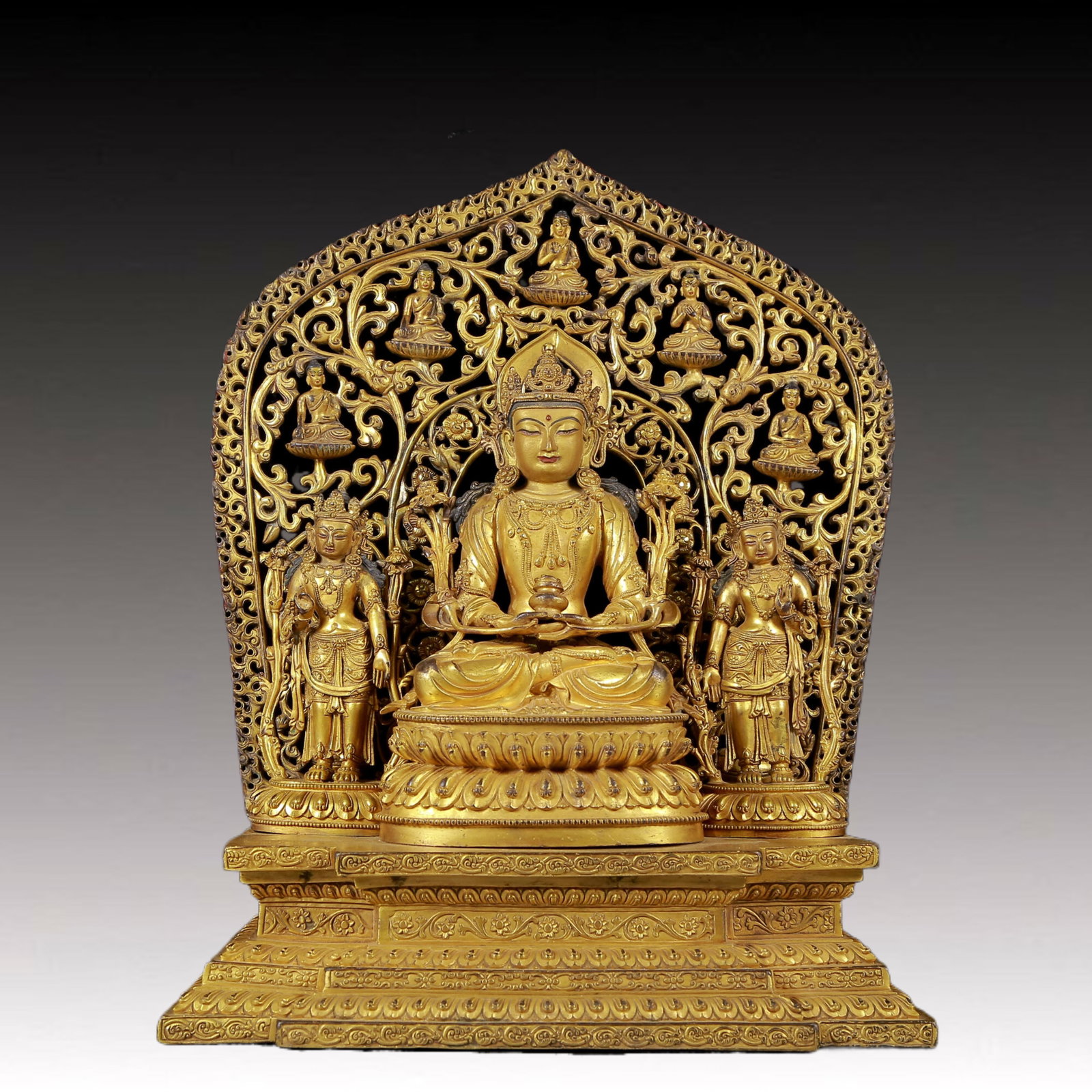 A Brilliant Gilt-Bronze Figure Of Amitayus: A Brilliant Gilt-Bronze Figure Of Amitayus. Seated on a base with a serene expression, body adorned with jewelry ornaments, topknot surmounted by a splendid diadem, and leafy plants flanking the shoul