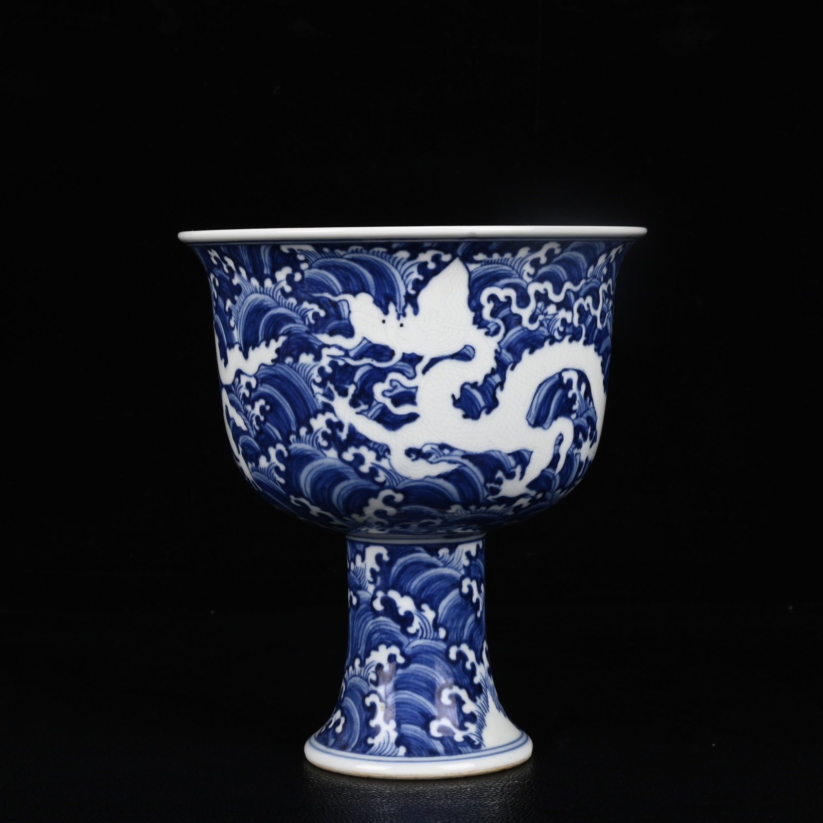 An Exquisite Blue and White Seawater and Dragon Pattern Stem Cup: An Exquisite Blue and White Seawater and Dragon Pattern Stem Cup,Ming Dynasty,China,Xuande Six-character Mark,Size:6.7inx5.7in