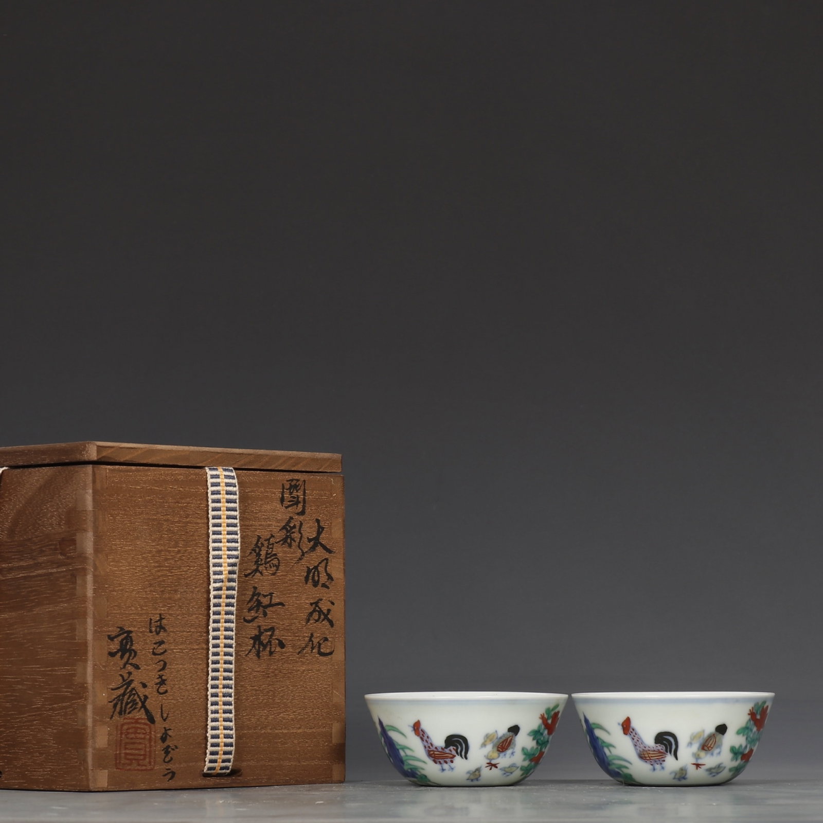 A Pair of Exquisite Doucai Rooster Pattern Cups: A Pair of Exquisite Doucai Rooster Pattern Cups,Ming Dynasty,China,Chenghua Six-Character Mark,Size:1.4inx3.3in 一对斗彩公鸡纹杯,中国明