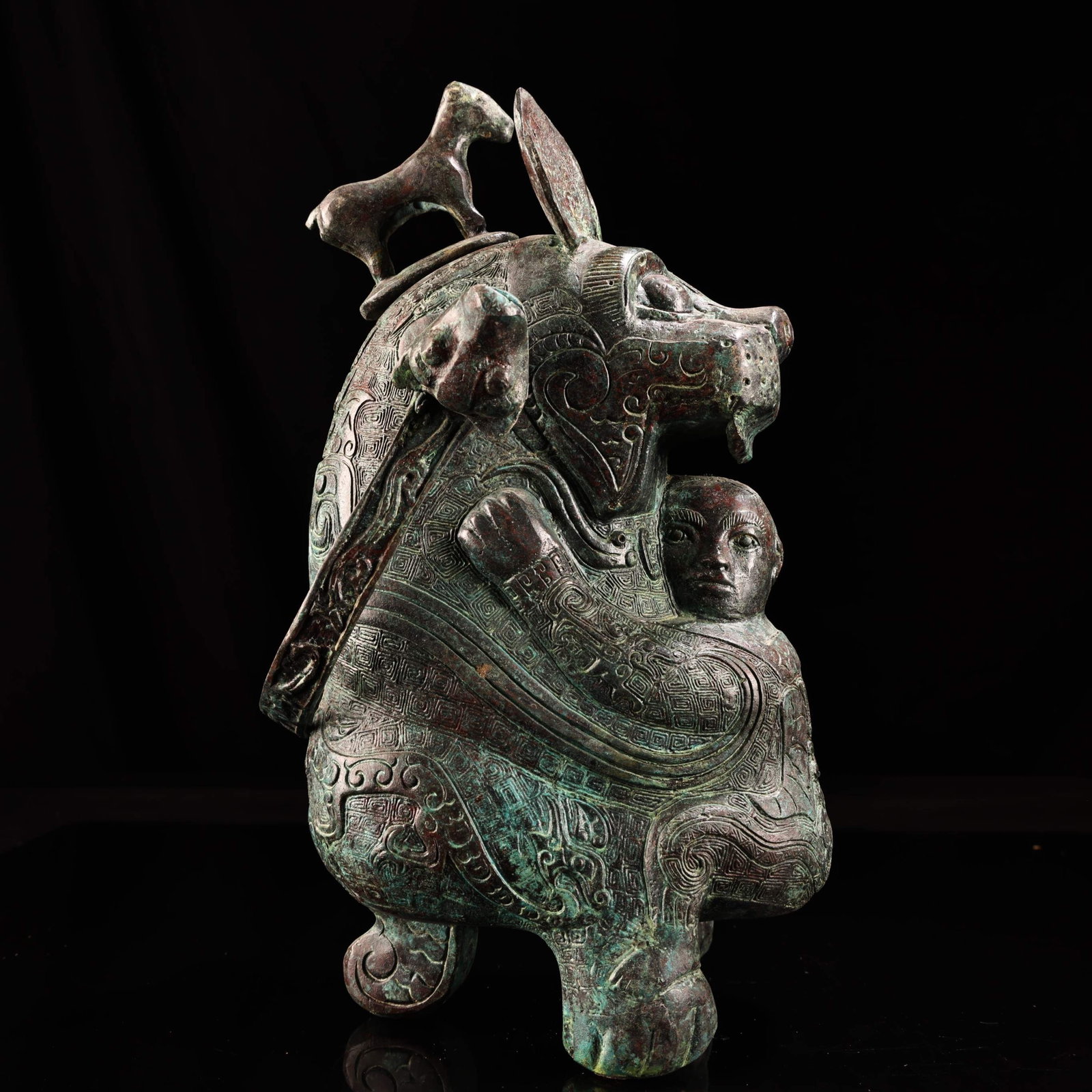 An Archaic Bronze Figure and Auspicious Beast Tripod Jar: An Archaic Bronze Figure and Auspicious Beast Tripod Jar,Ancient Time,China,Size:11.8inx 6.3in,Weight:2960g 青铜人物瑞兽三足罐,中国