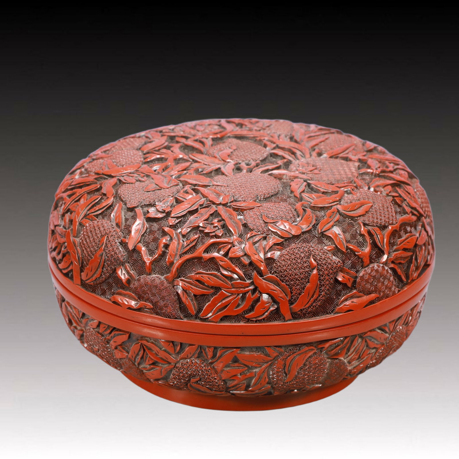 An Exquisite Carved Red Lacquer Peach Pattern Box: An Exquisite Carved Red Lacquer Peach Pattern Box,Qing Dynasty, China, Qianlong Six-character Mark,Size:10.6inx5.9inWeight:2300g 剔红漆桃纹盒,中国଀