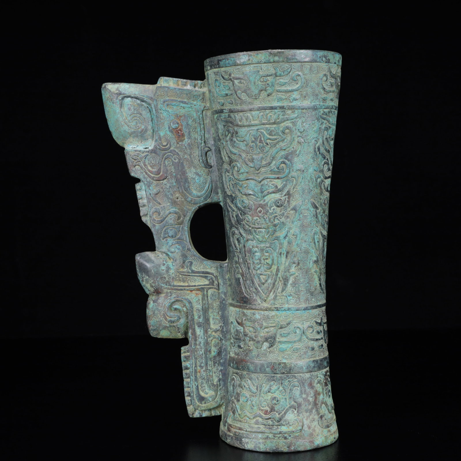 An Archaic Bronze Beast-Face Pattern Cup: An Archaic Bronze Beast-Face Pattern Cup,the Warring States Period in China,Size:5.9inx3.3inx9.4in,Weight:1400g 青铜兽面纹杯,中国战国时