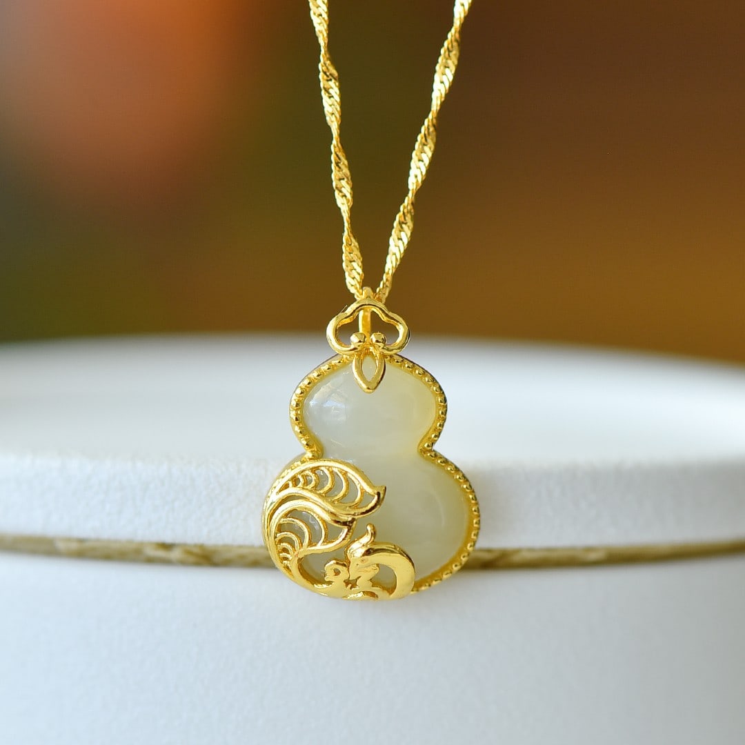 An Exquisite Sterling Silver-Gold Plated Inlaid White Jade Pendant: An Exquisite Sterling Silver-Gold Plated Inlaid White Jade Pendant 纯银镀金镶白玉吊坠
