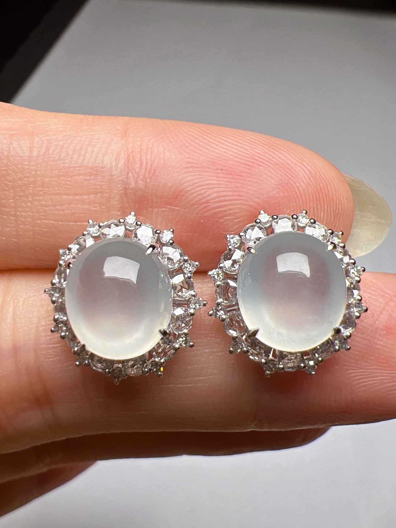 A Pair of Exquisite 18k Gold Diamond Inlaid Jadeite Earrings: A Pair of Exquisite 18k Gold Diamond Inlaid Jadeite Earrings,Size(Loose Stone):9.1mmx8.2mm 一对18k金钻镶嵌翡翠耳钉