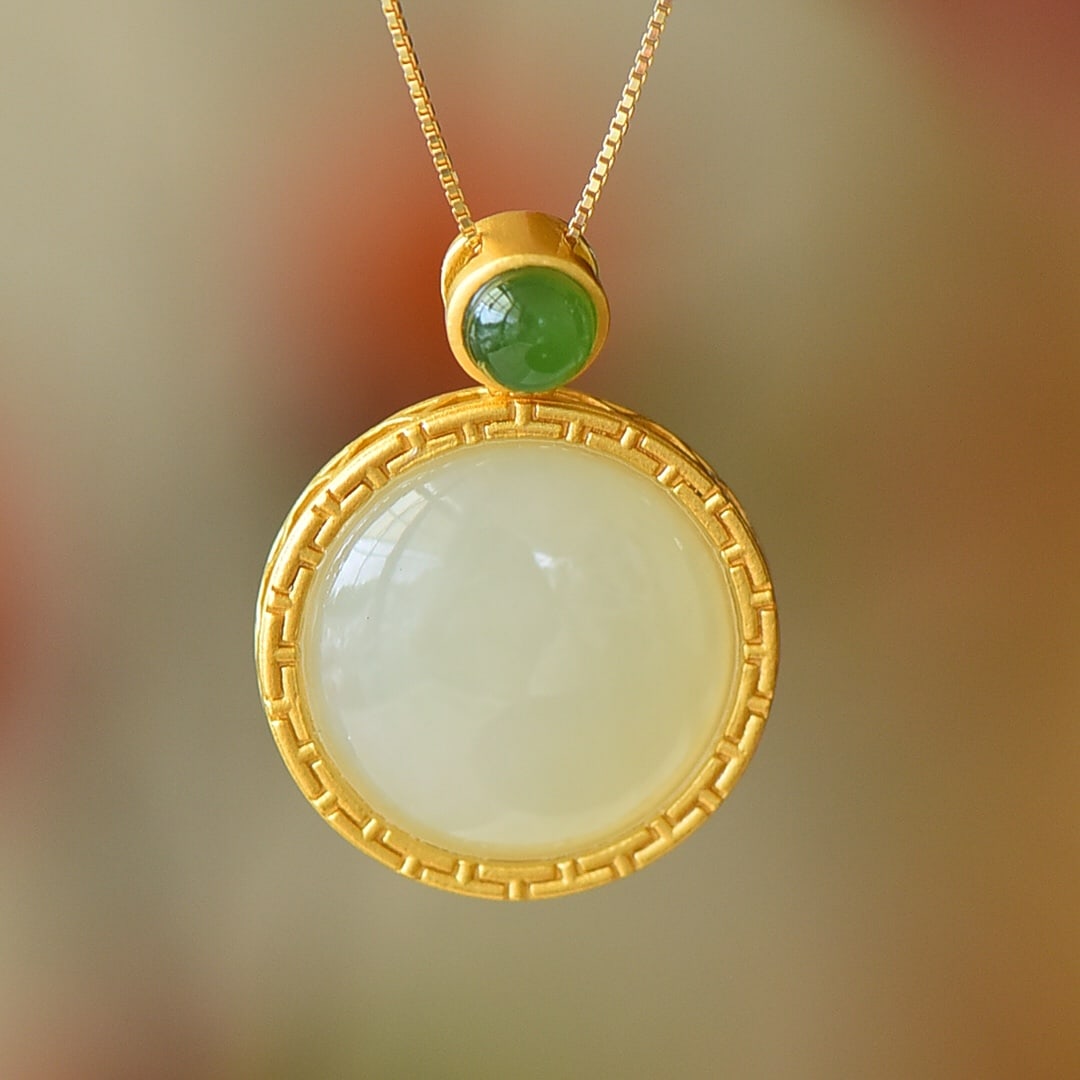 An Exquisite Sterling Silver-Gold Plated Inlaid White Jade Pendant: An Exquisite Sterling Silver-Gold Plated Inlaid White Jade Pendant 纯银镀金镶白玉吊坠