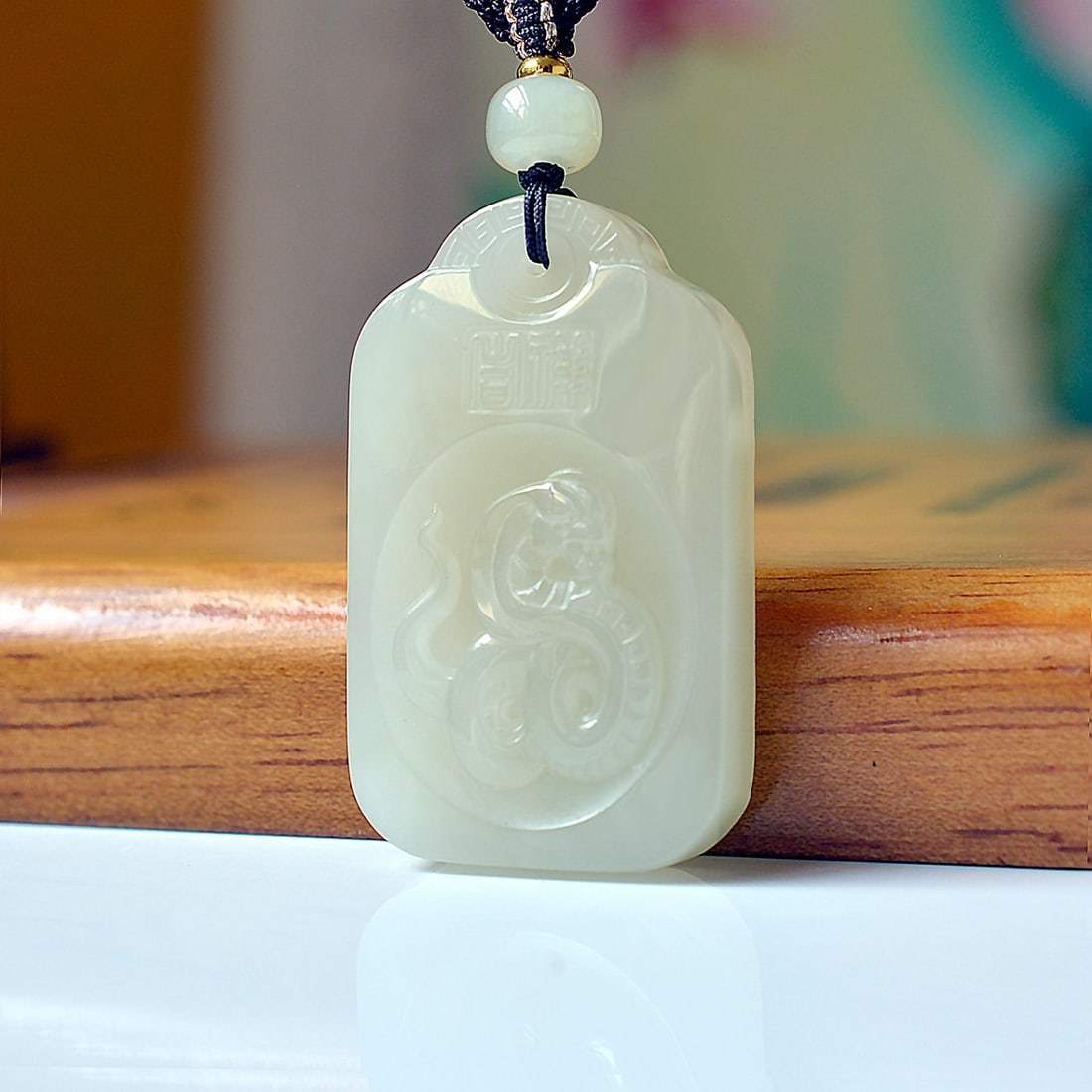 An Exquisite White Jade Snake Pattern Pendant: An Exquisite White Jade Snake Pattern Pendant,Size:28mmx47mm 白玉蛇纹挂件