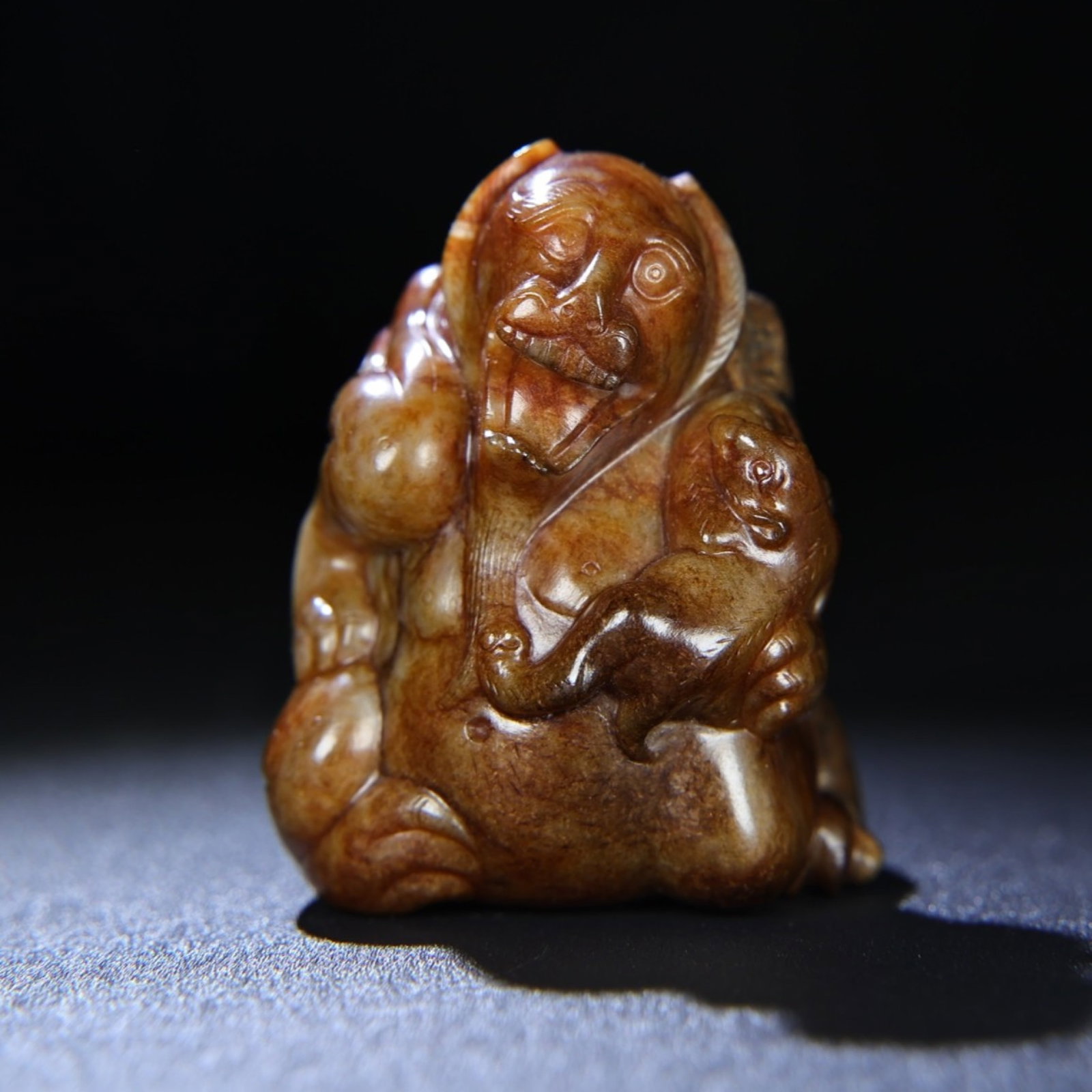 An Exquisite Archaic Jade Bear Hand Piece: An Exquisite Archaic Jade Bear Hand Piece,Ancient Time,China,Size:75mmx62mmx54mm,Weight:337g 高古玉熊手把件,中国远古时期
