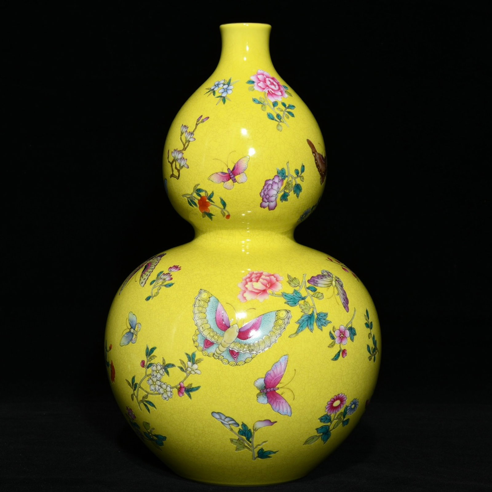 An Exquisite Yellow Ground Famille-Rose Flower and Butterfly Pattern Gourd-Shaped Vase: An Exquisite Yellow Ground Famille-Rose Flower and Butterfly Pattern Gourd-Shaped Vase,Qing Dynasty,China,Qianlong Six-character Mark,Size:11.5inx7.1in 黄地粉彩花卉