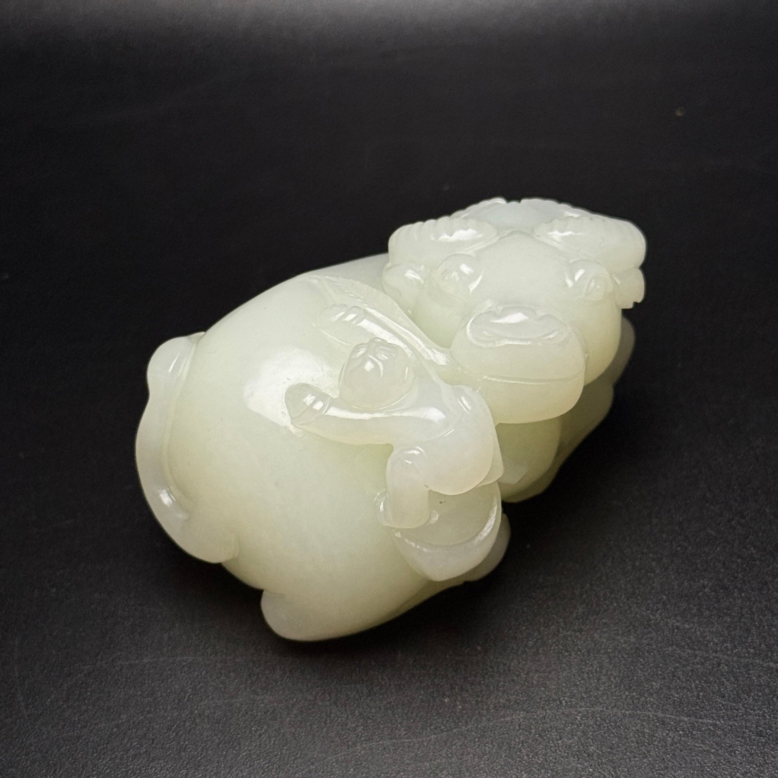 An Exquisite White Jade Buffalo Ornament: An Exquisite White Jade Buffalo Ornament,Qing Dynasty,China,Size:63mmx82mmx48mm,Weight:362g 白玉牛摆件,中国清代