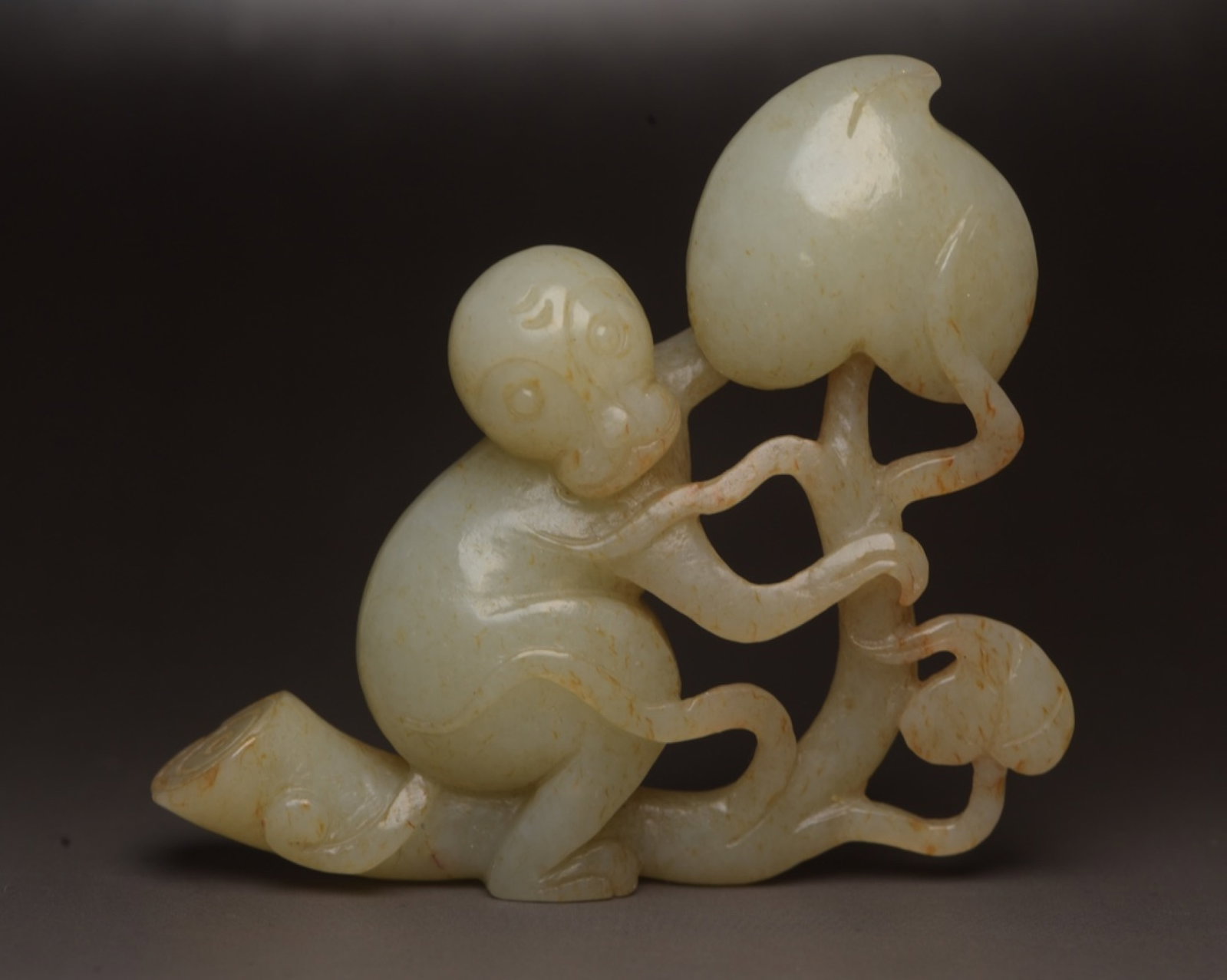 An Exquisite White Jade Monkey Ornament: An Exquisite White Jade Monkey Ornament,Qing Dynasty,China,Size:2.6inx2.4inx0.7in,Weight:55g 白玉猴子摆件,中国清代