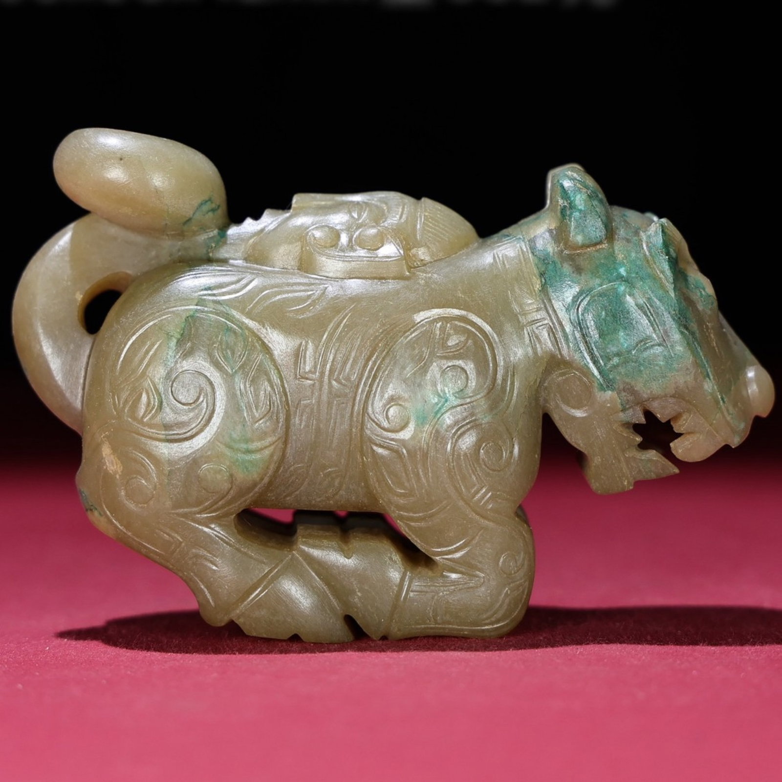 An Exquisite Archaic Jade Tiger Ornament (1 of 9)