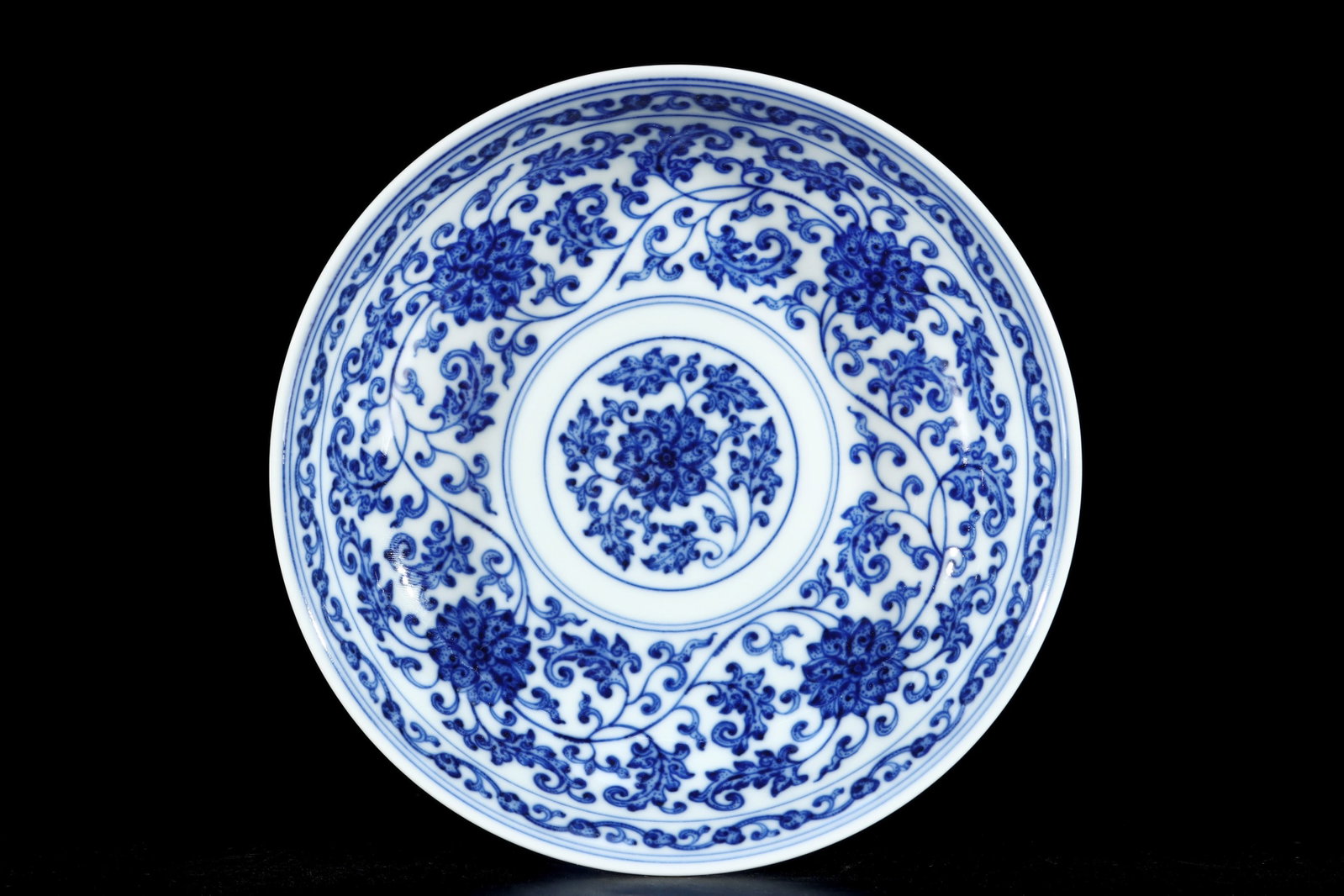 An Exquisite Blue and White Lotus Pattern Stem Plate: An Exquisite Blue and White Lotus Pattern Stem Plate,Qing Dynasty,China,Qianlong Six-character Mark,Size:2.9inx6.7in 青花缠枝莲纹高足盘,中&#