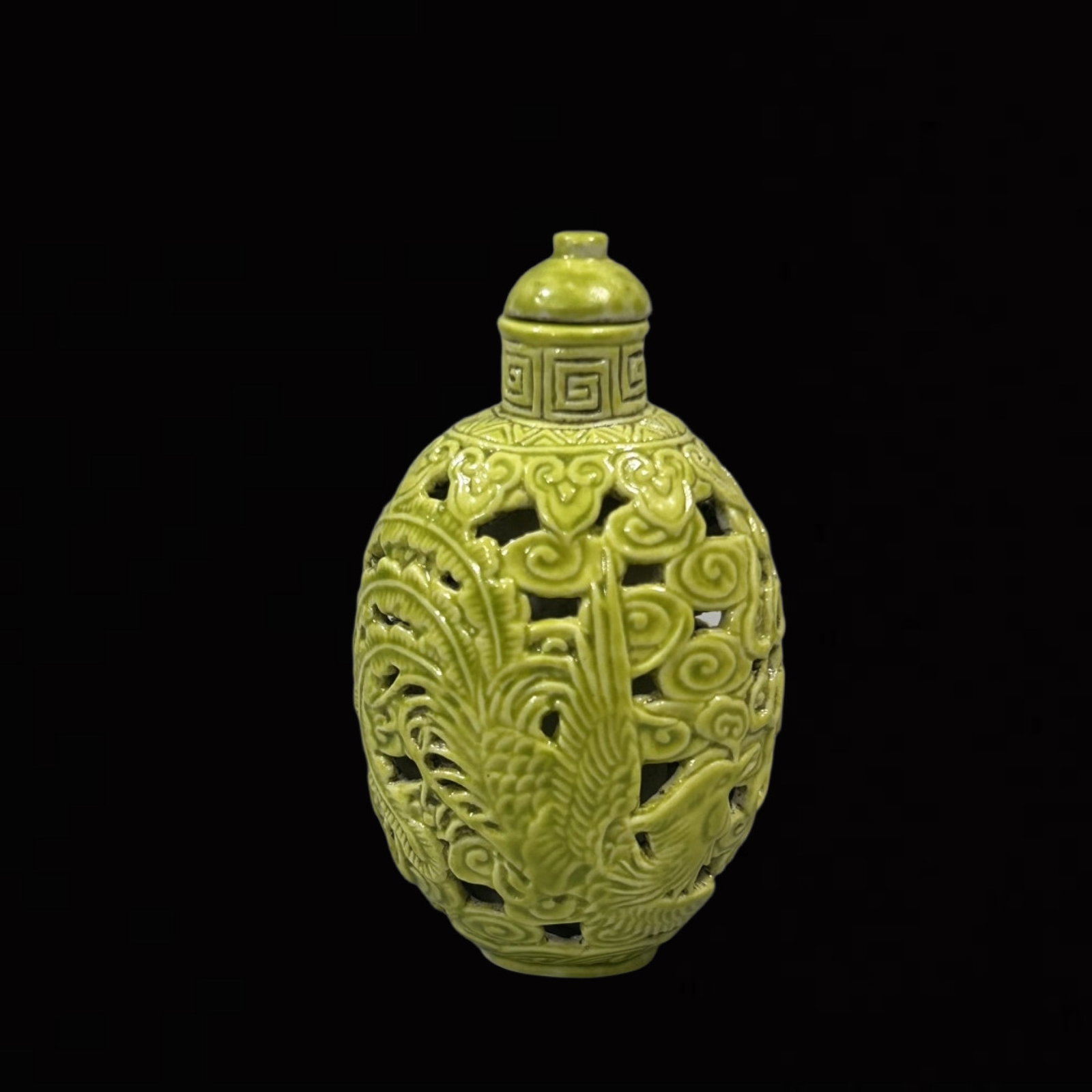 An Exquisite Yellow Glazed Hollow Dragon and Phoenix Pattern Snuff Bottle: An Exquisite Yellow Glazed Hollow Dragon and Phoenix Pattern Snuff Bottle,Qing Dynasty,China,Qianlong Four-character Mark,Size:3inx1.6in 黄釉镂空龙凤纹鼻