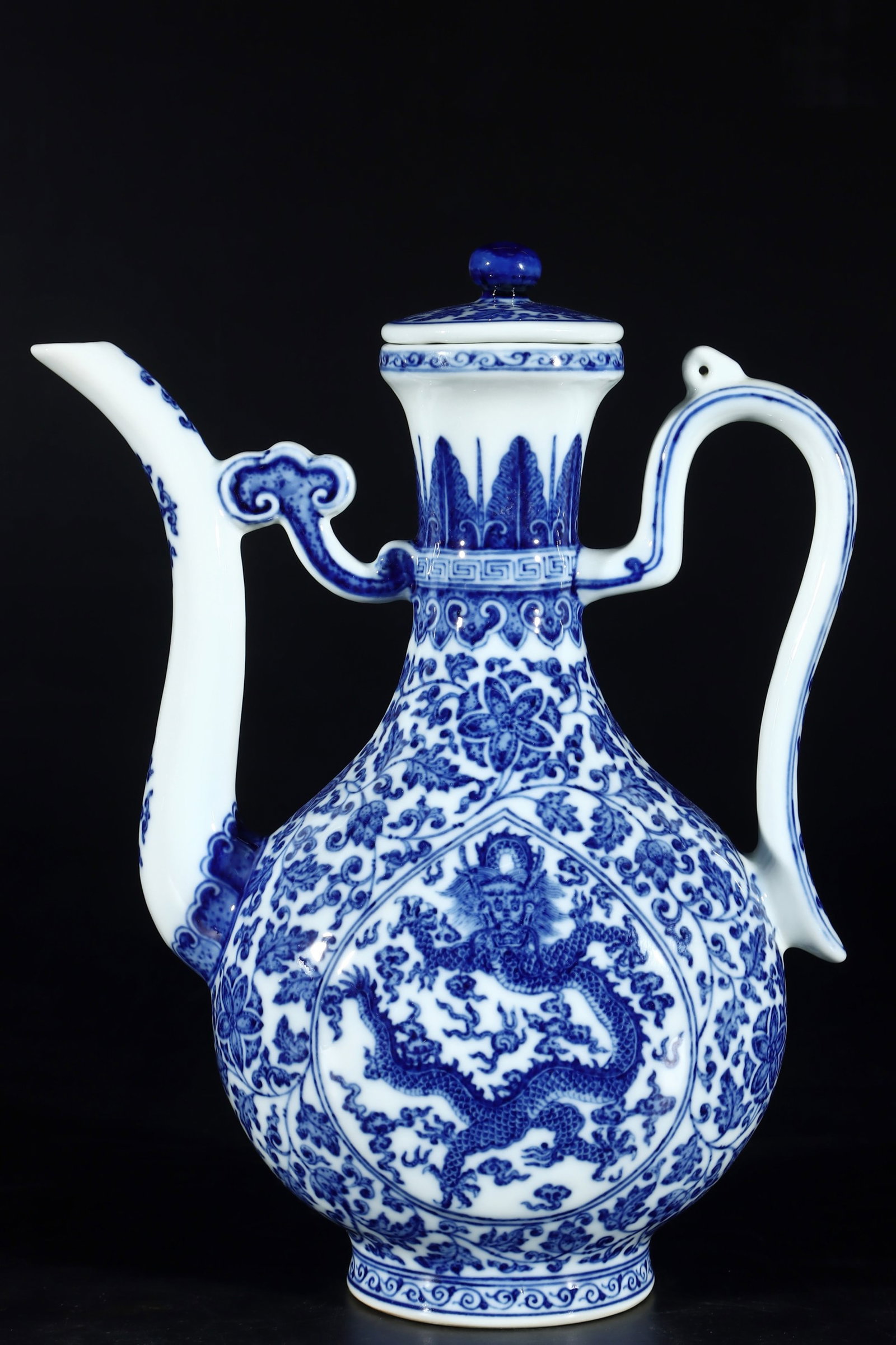 A Rare Blue and White Lotus and Dragon Pattern Ewer: A Rare Blue and White Lotus and Dragon Pattern Ewer,Qing Dynasty,China,Qianlong Six-character Mark,Size:11.8inx6.4in 青花缠枝莲龙纹执壶,中&#