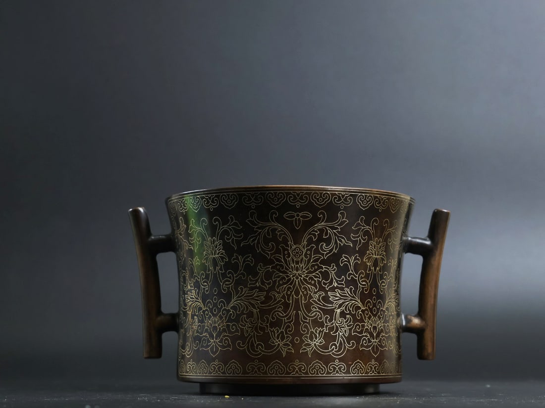 An Exquisite Bronze Inlaid Silver Lotus Pattern Double-Ears Censer: An Exquisite Bronze Inlaid Silver Lotus Pattern Double-Ears Censer,Qing Dynasty, China, With Mark,Size:3.5inx4.6in,Weight:1970g 铜嵌银缠枝莲纹双耳