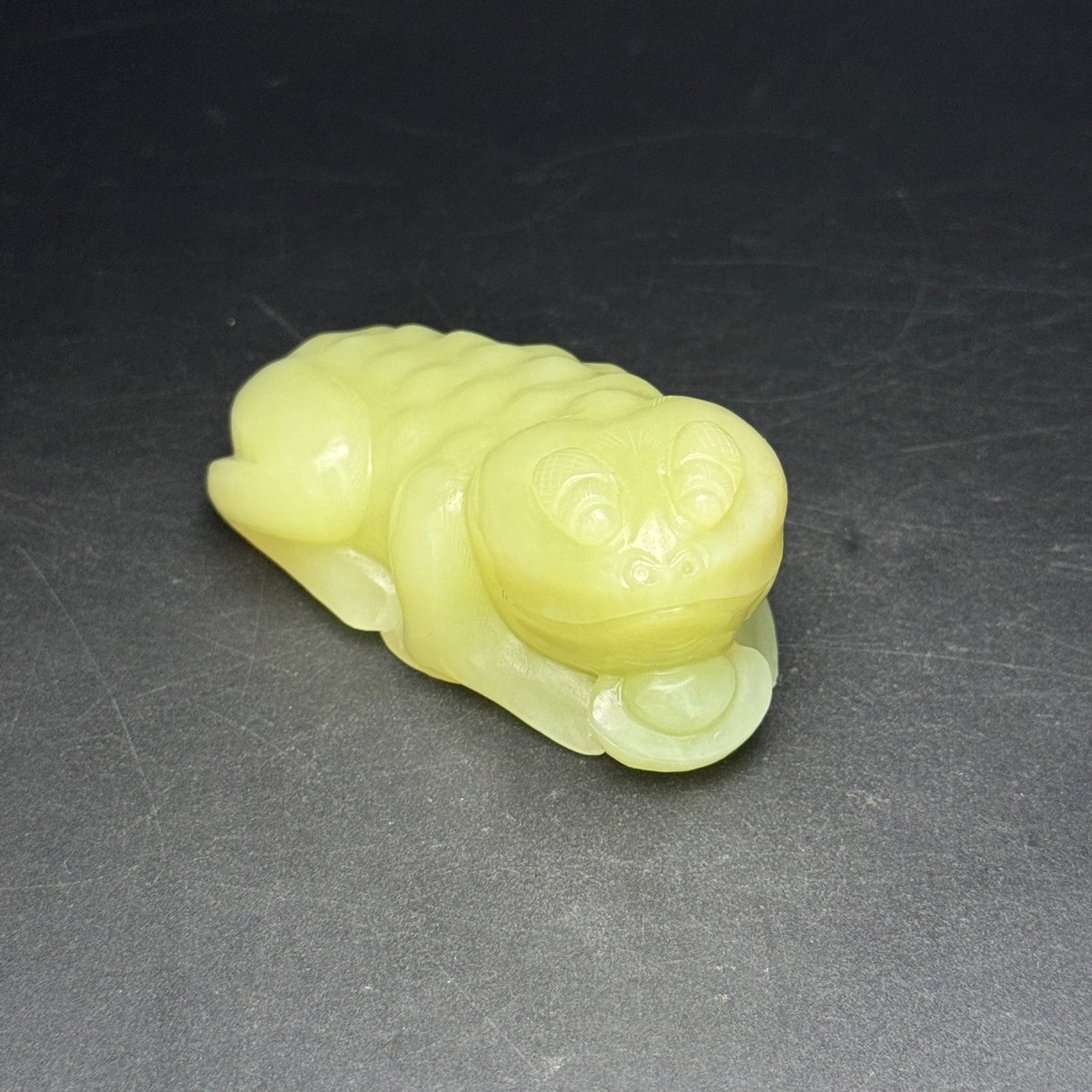 An Exquisite Yellow Jade Golden Toad Ornament: An Exquisite Yellow Jade Golden Toad Ornament,Qing Dynasty,China,Size:76mmx39mmx36mm,Weight:147g 黄玉金蟾摆件,中国清代