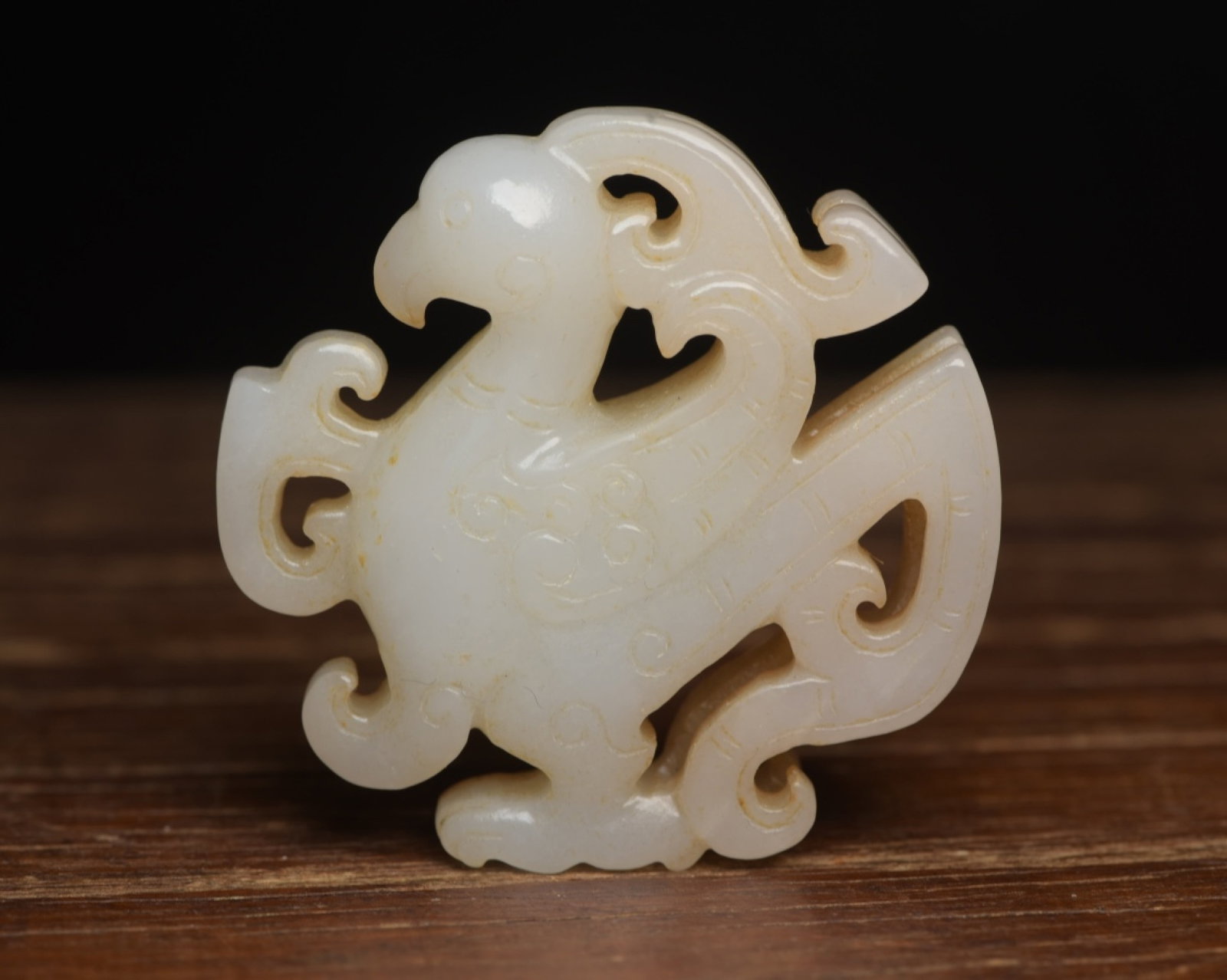 An Exquisite White Jade Phoenix Pendant: An Exquisite White Jade Phoenix Pendant,Qing Dynasty,China,Size:2.2inx2.1inx0.5in,Weight:56g 白玉凤佩,中国清代
