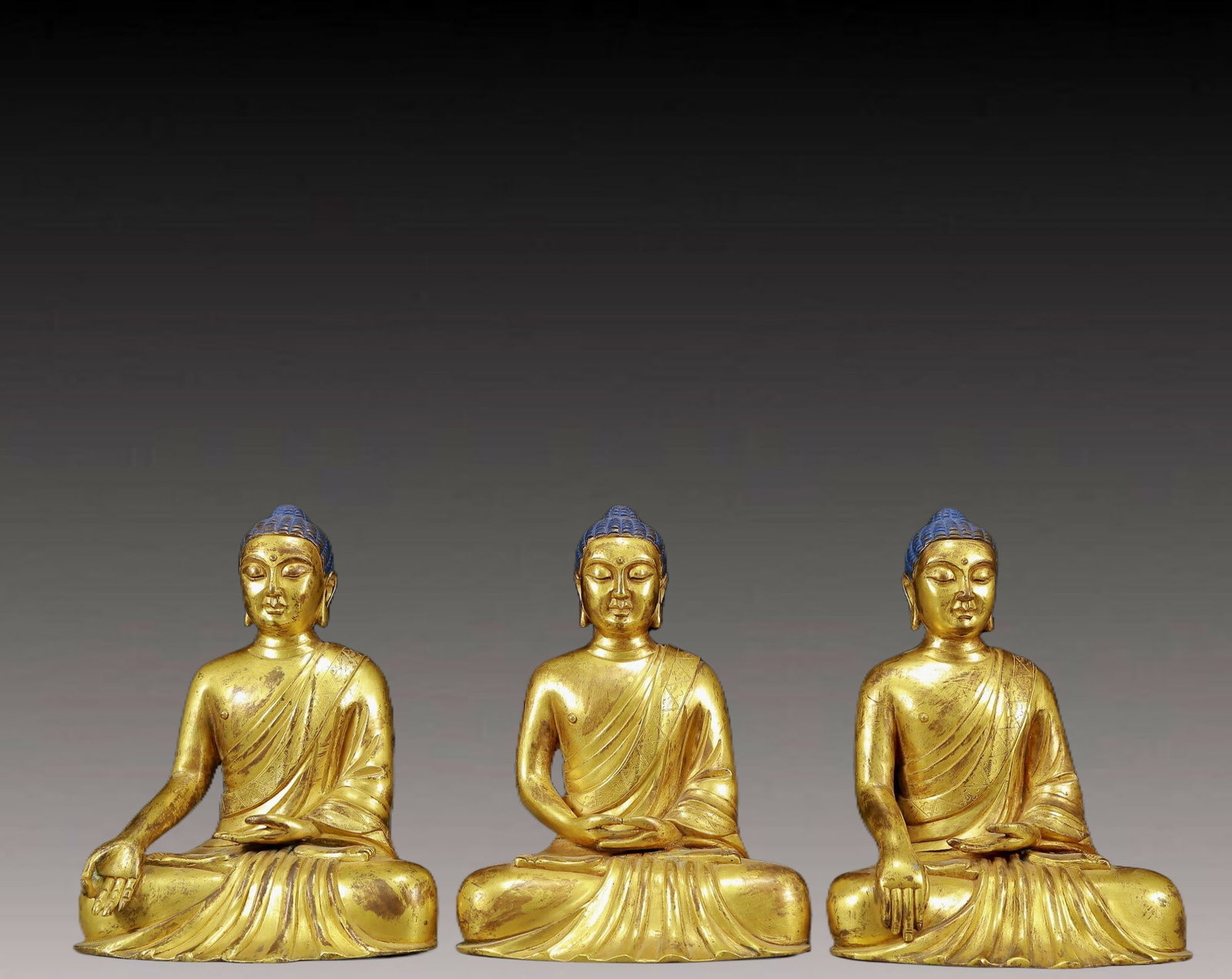 A Pair of Solemn Gilt Bronze Statue of Sakyamuni: A Pair of Solemn Gilt Bronze Statue of Sakyamuni,Ming Dynasty, China,Size:6.3inx4.1inx7.9in,Weight:6645g 一组铜鎏金释迦摩尼像，明