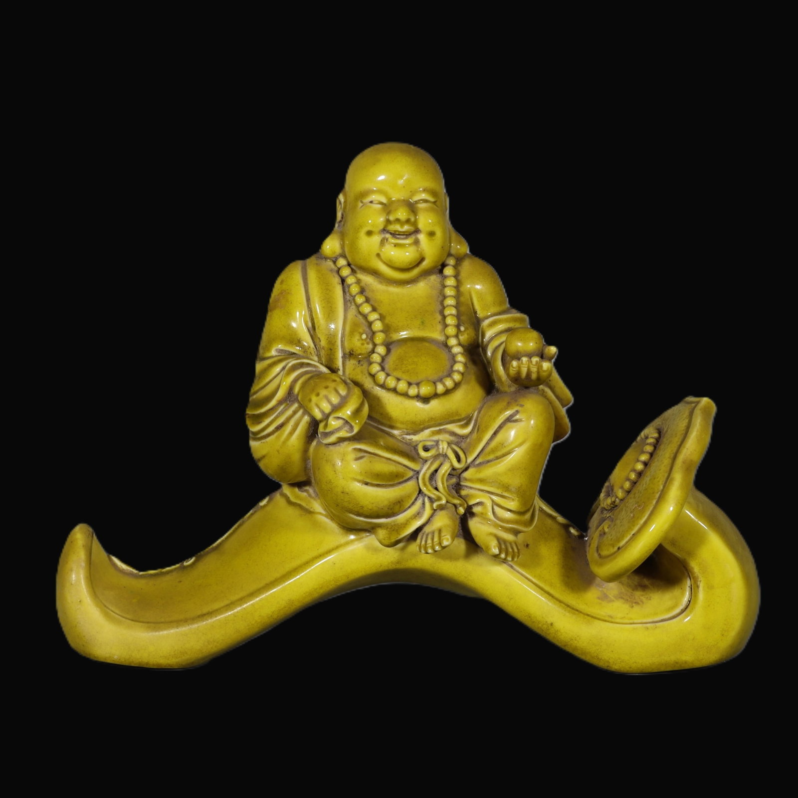 An Exquisite Yellow Glazed Statue of Maitreya Buddha: An Exquisite Yellow Glazed Statue of Maitreya Buddha,Qing Dynasty,China,Size:7.5inx9.4inx3.9in 黄釉弥勒佛像,中国清代