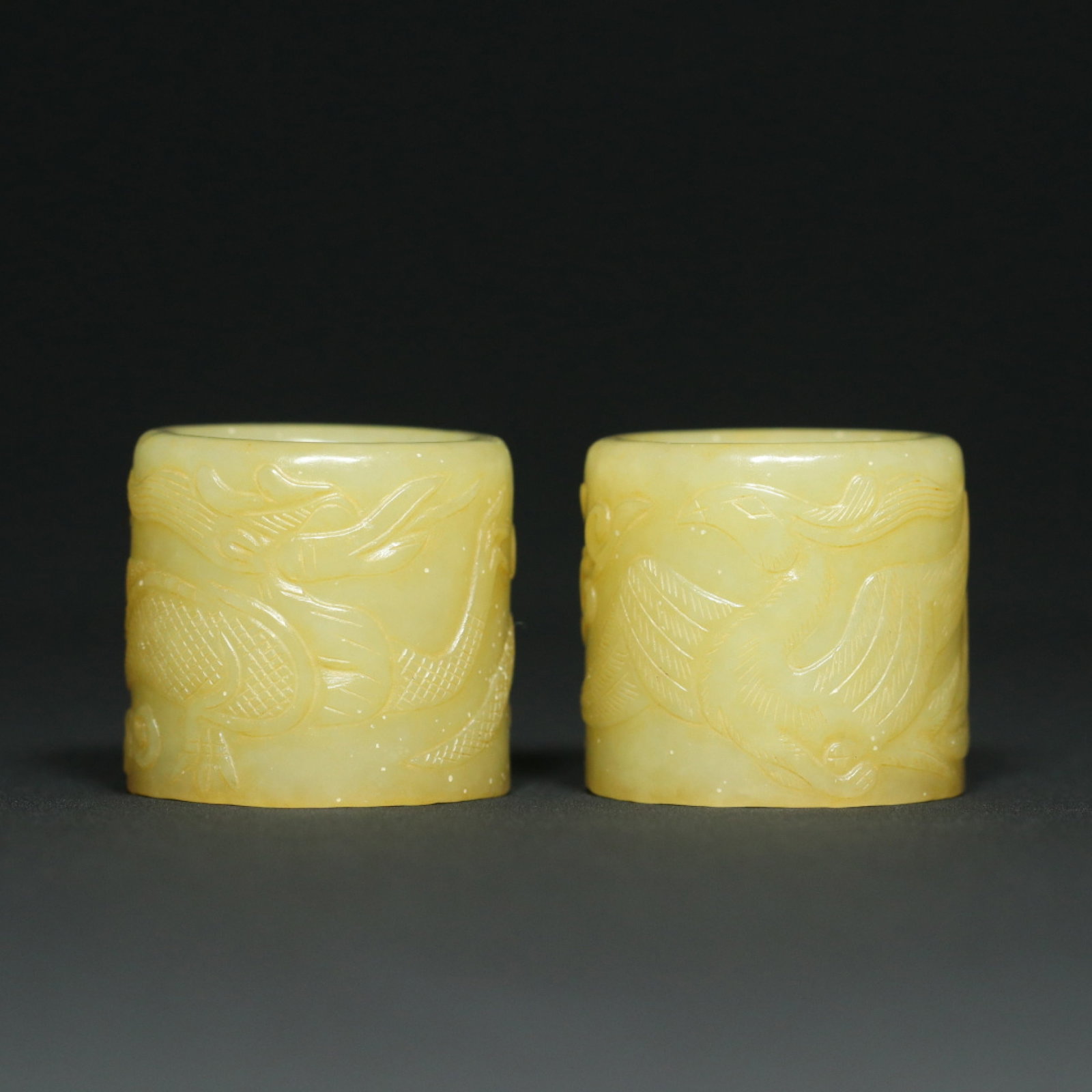A Pair of Exquisite White Jade Dragon and Phoenix Pattern Thumb Rings: A Pair of Exquisite White Jade Dragon and Phoenix Pattern Thumb Rings,Qing Dynasty,China,Size:1.3inx1.4inx0.9in,Weight:94.3g 一对白玉龙凤纹扳指,&#