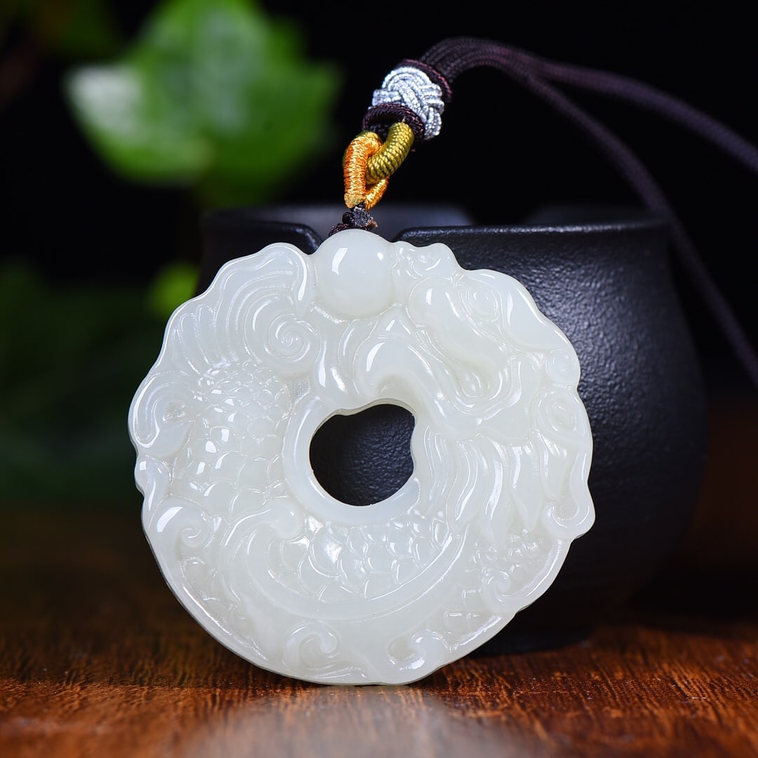 An Exquisite White Jade Dragon Pattern Pendant: An Exquisite White Jade Dragon Pattern Pendant,Size:50mmx52mm 白玉龙纹挂件