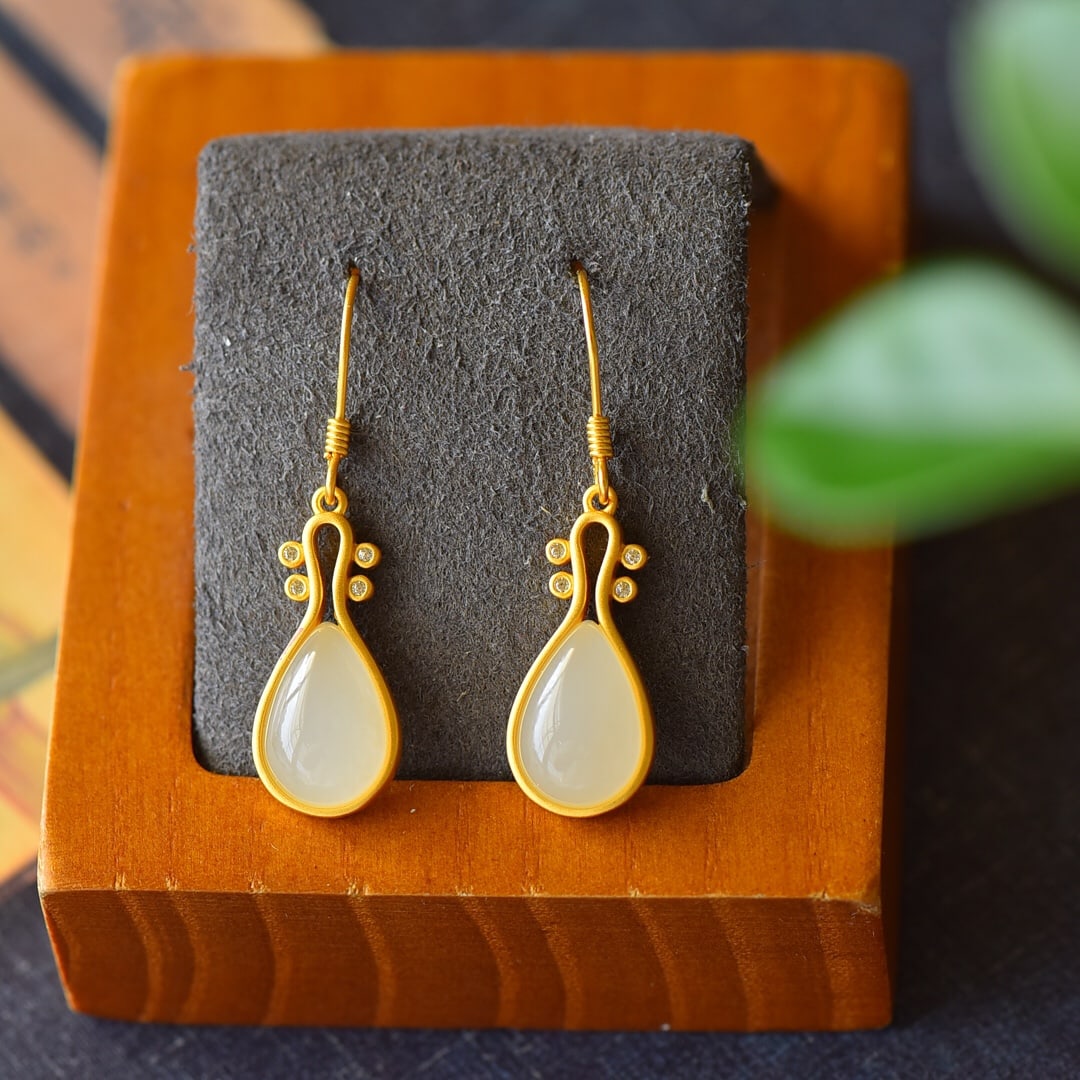 A Pair of Exquisite Sterling Silver-Gold Plated Inlaid White Jade Earrings: A Pair of Exquisite Sterling Silver-Gold Plated Inlaid White Jade Earrings,Size:10mmx36mm 一对纯银镀金镶白玉耳环