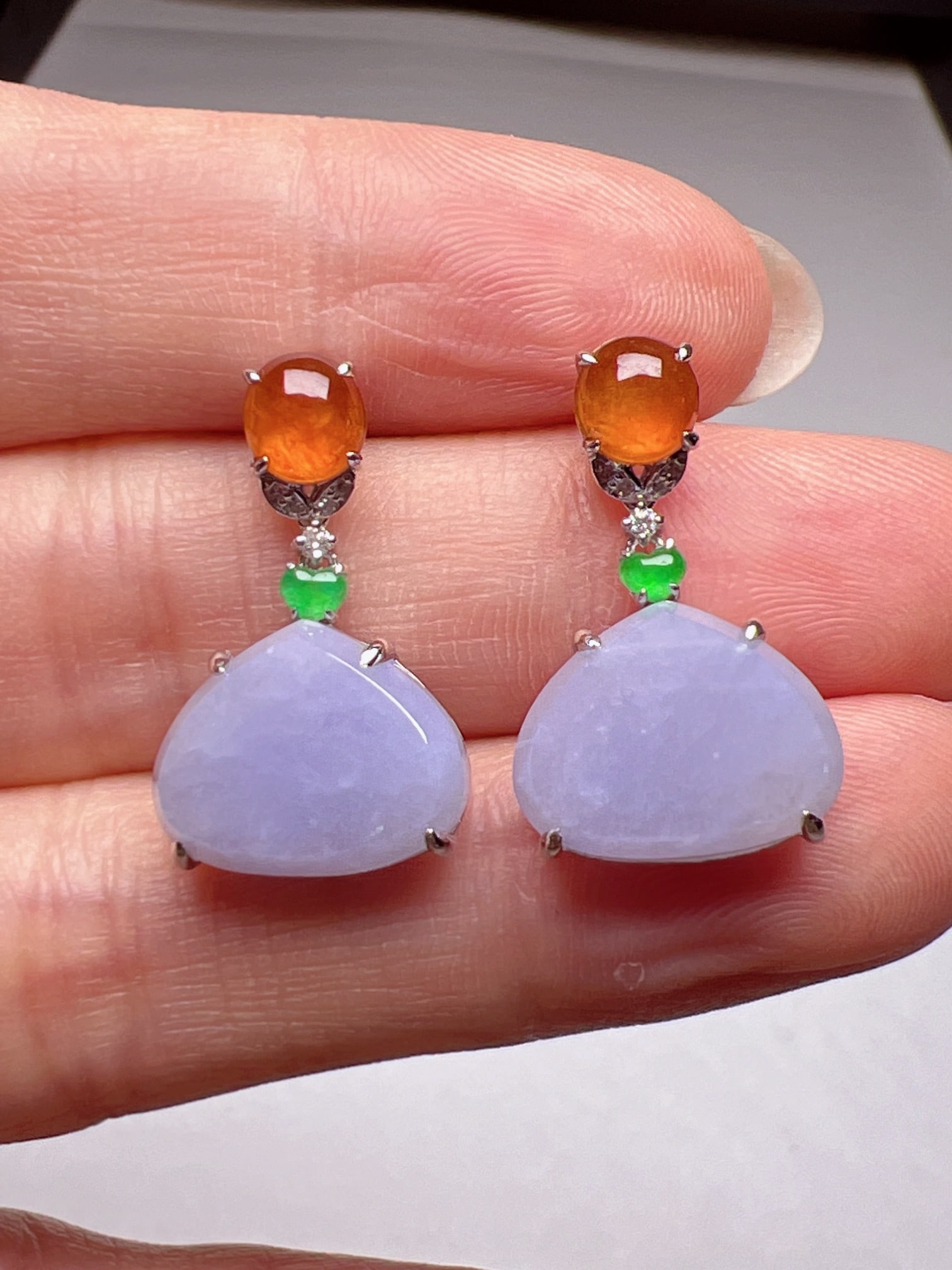 A Pair of Exquisite 18k Gold Diamond Inlaid Jadeite Earrings: A Pair of Exquisite 18k Gold Diamond Inlaid Jadeite Earrings,Size(Loose Stone):10.2mmx12.9mm 一对18k金钻镶嵌翡翠耳环