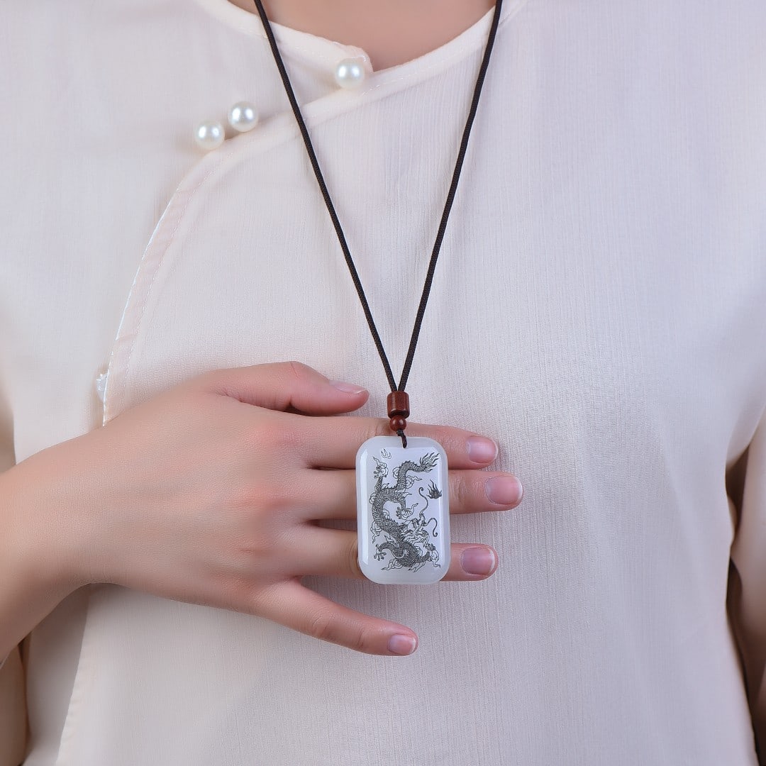 An Exquisite White Jade Dragon Pattern Pendant (1 of 4)