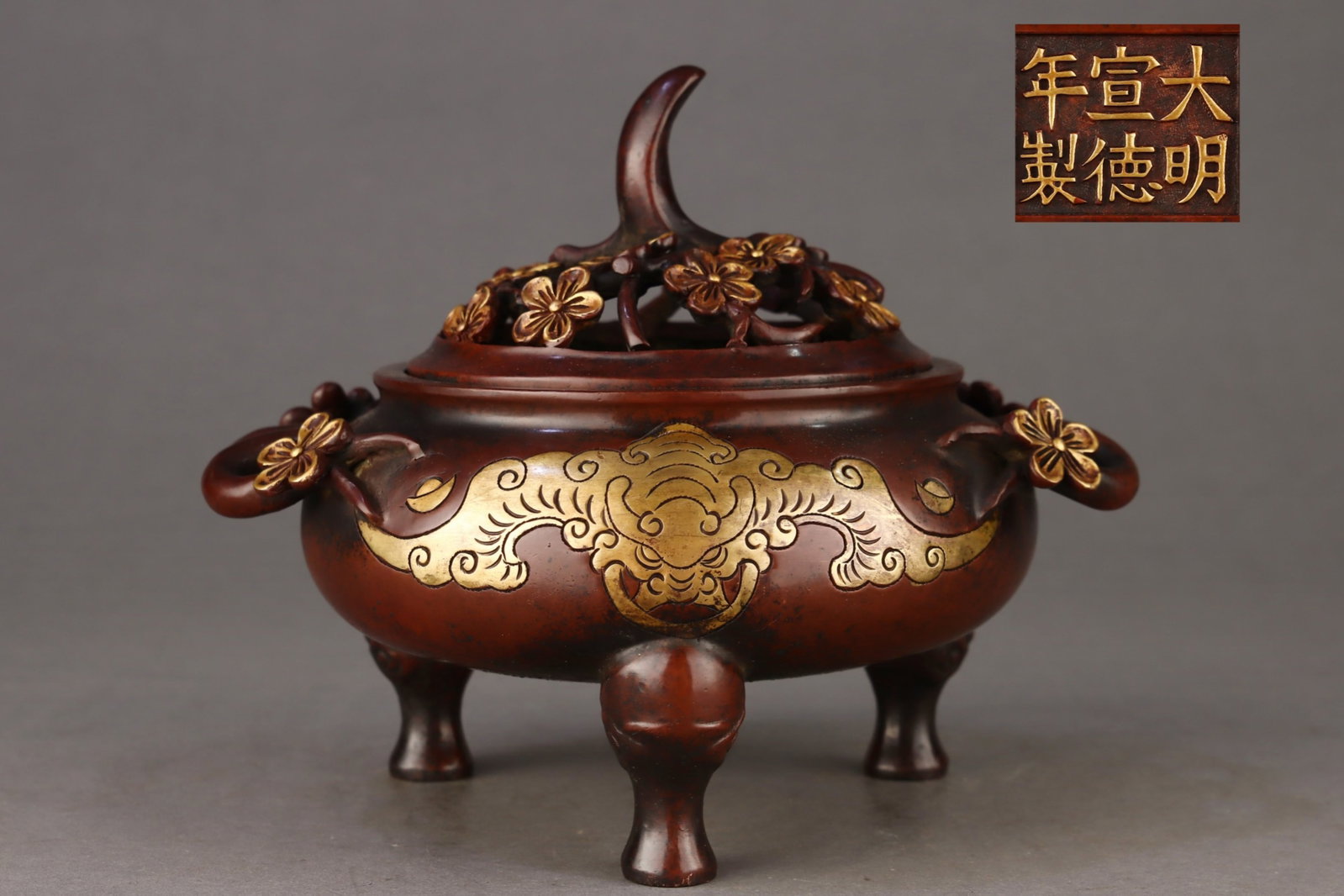 An Exquisite Gilt Bronze Plum Blossom and Bats Pattern Double-Ears Tripod Censer: Estimated Value:1600-3200 An Exquisite Gilt Bronze Plum Blossom and Bats Pattern Double-Ears Tripod Censer,Ming Dynasty,China,Xuande Six-character Mark,Size:7.1inx5.4inx6.7inx8.5in,Weight:3800g