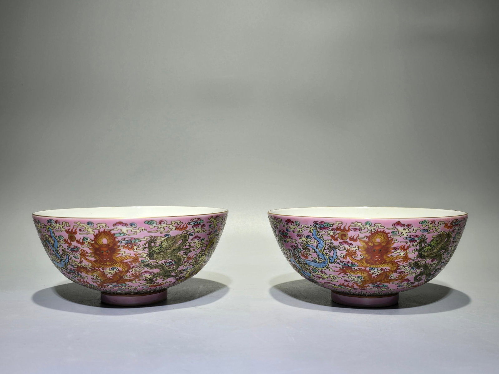 A Pair of Exquisite Famille-Rose Pink Ground Painted Gold Seawater Auspicious Cloud and Dragon Pa...: Estimated Value:2000-4000 A Pair of Exquisite Famille-Rose Pink Ground Painted Gold Seawater Auspicious Cloud and Dragon Pattern Bowls,Qing Dynasty,China,Yongzheng Six-character Mark,Size:2.7inx5.7in