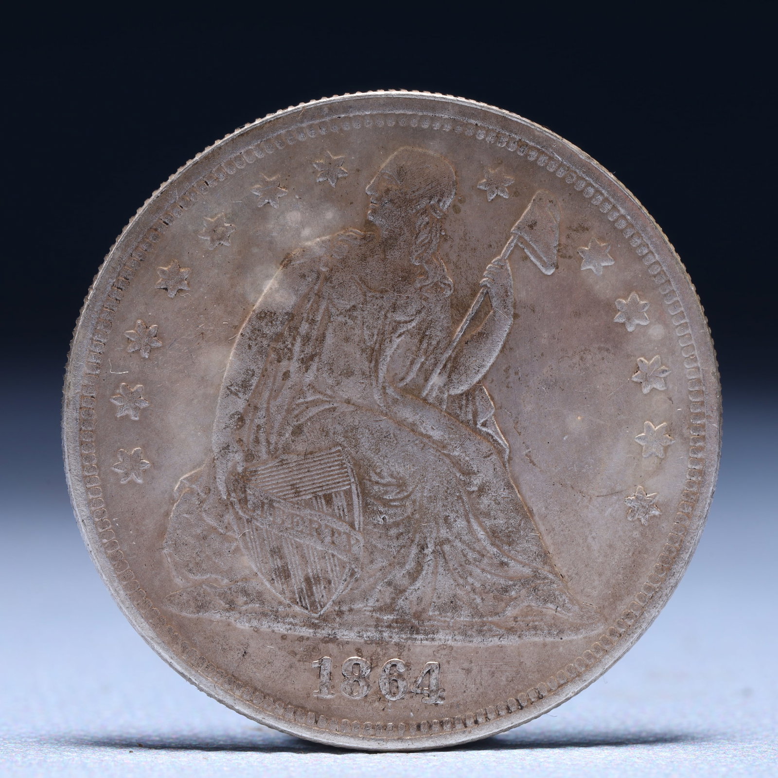 USA One Dollar 1864 Coin: Estimated Value:3500-7000 American coin. IN GOD WE TRUST / LIBERTY / 1864 / UNITED STATES OF AMERICA / ONE DOL. Weight:26.9g.