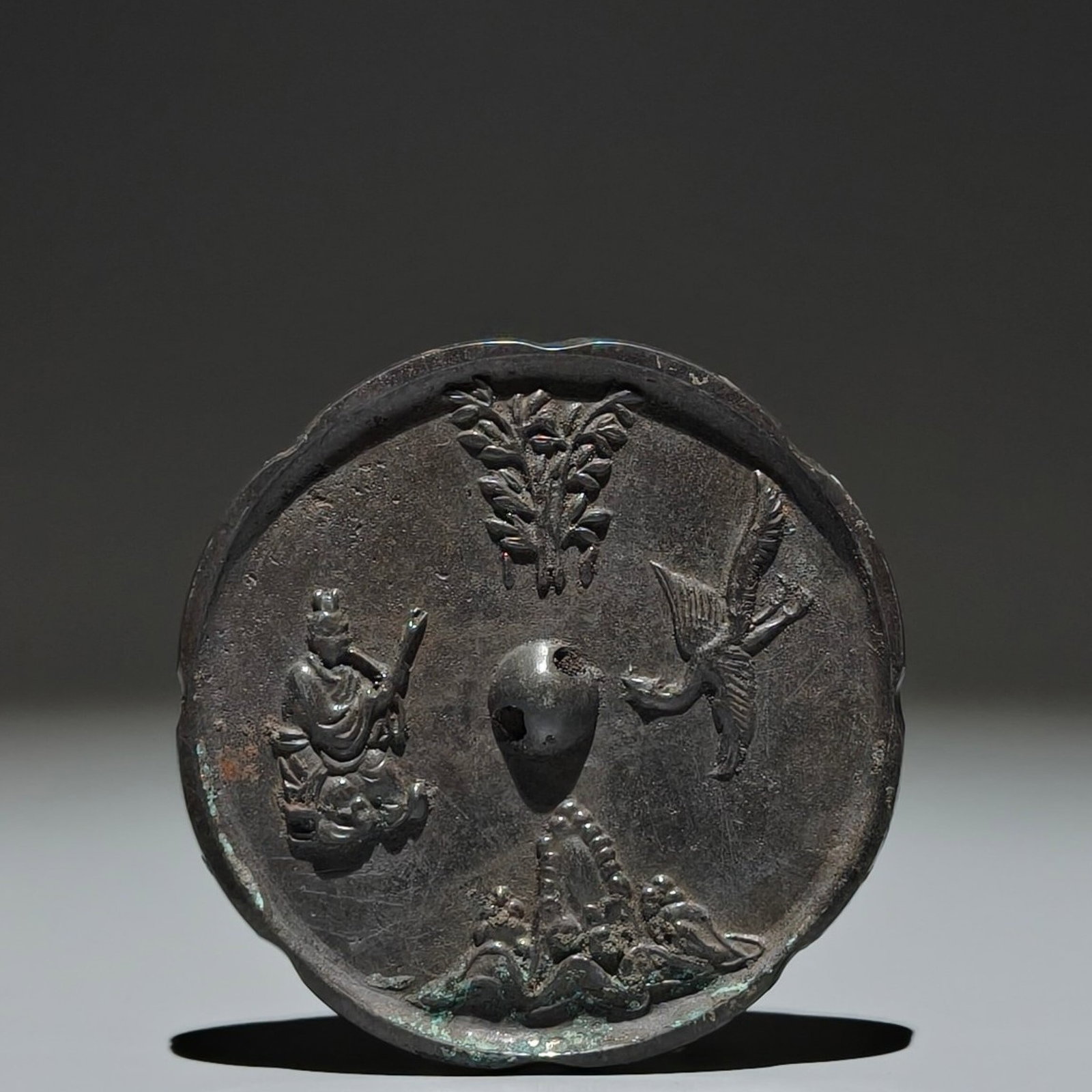 An Archaic Bronze Figure Phoenix Pattern Mirror: Estimated Value:600-1200 An Archaic Bronze Figure Phoenix Pattern Mirror,Tang Dynasty,China,Size:3.5in 青铜人物凤纹镜子,中国唐代