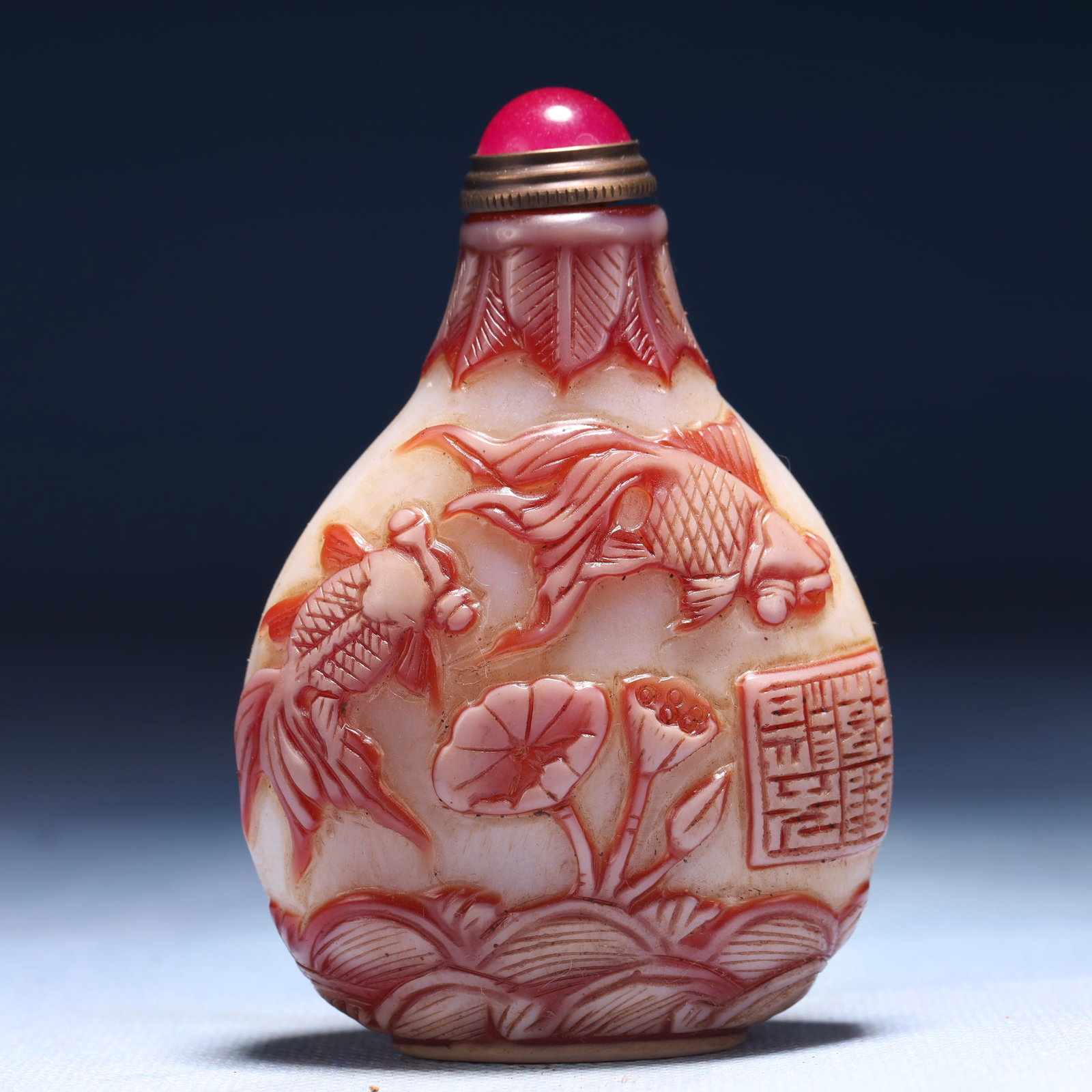 An Exquisite Glass Flower and Fish Pattern Snuff Bottle: Estimated Value:400-800 An Exquisite Glass Flower and Fish Pattern Snuff Bottle,Qing Dynasty,China,Qianlong Four-character Mark,Size:2.4inx1.2inx3.1in,Weight:79g