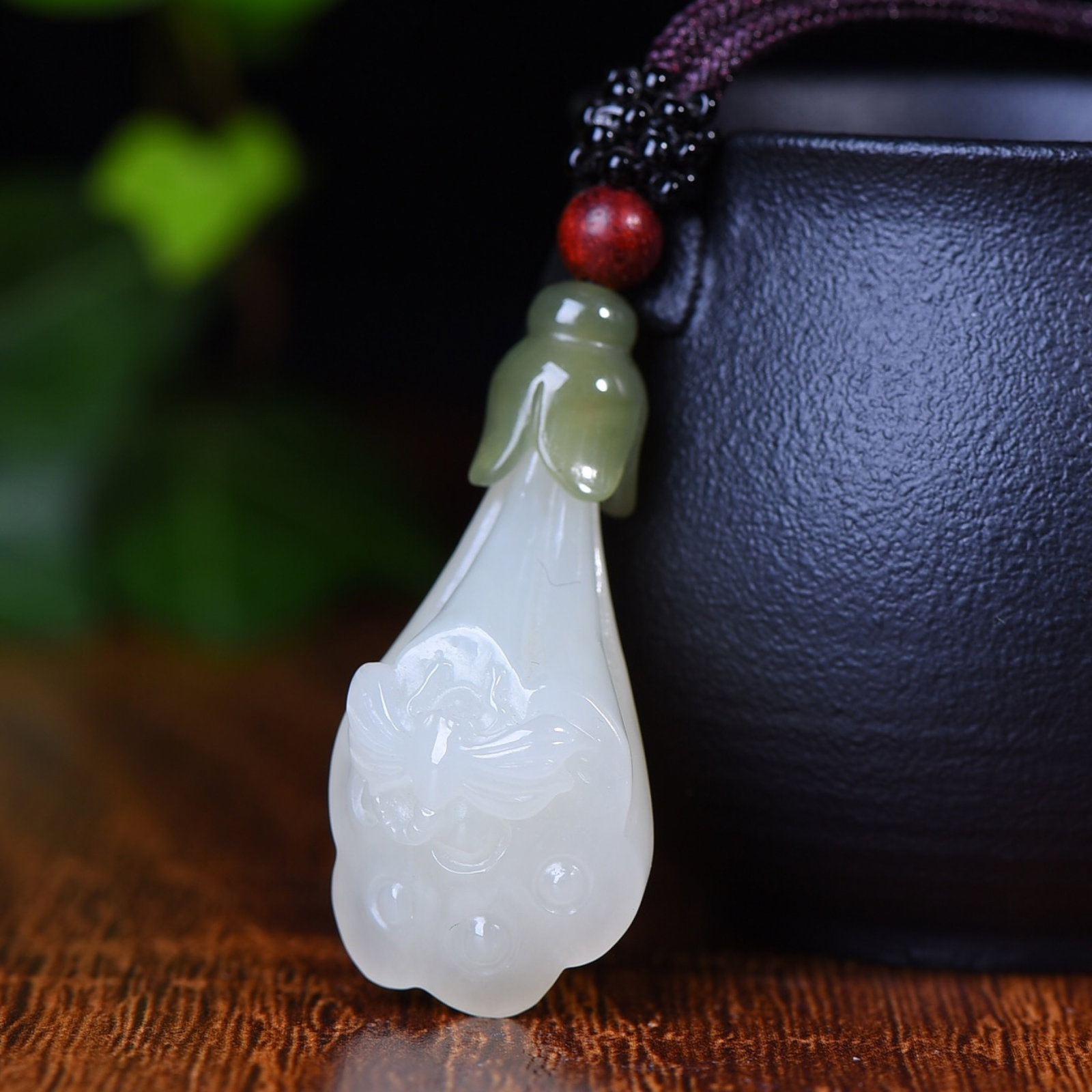 An Exquisite White Jade Lotus Seedpod and Butterfly Pendant: Estimated Value:720-1440 An Exquisite White Jade Lotus Seedpod and Butterfly Pendant,Size:43mmx20mm (寓意)美好 清洁高尚