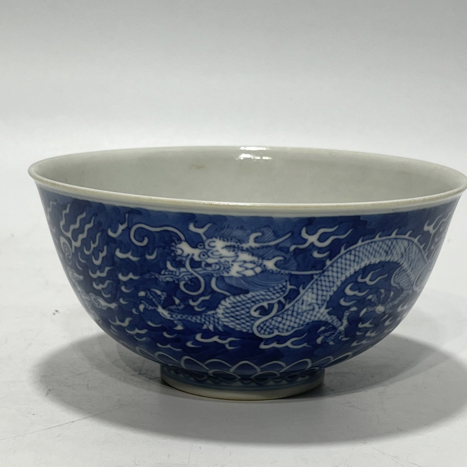 An Exquisite Blue and White Auspicious Cloud and Dragon Pattern Bowl: Estimated Value:1800-3600 An Exquisite Blue and White Auspicious Cloud and Dragon Pattern Bowl,Qing Dynasty,China,Daoguang Six-character Mark,Size:5.5in 青花祥云龙纹