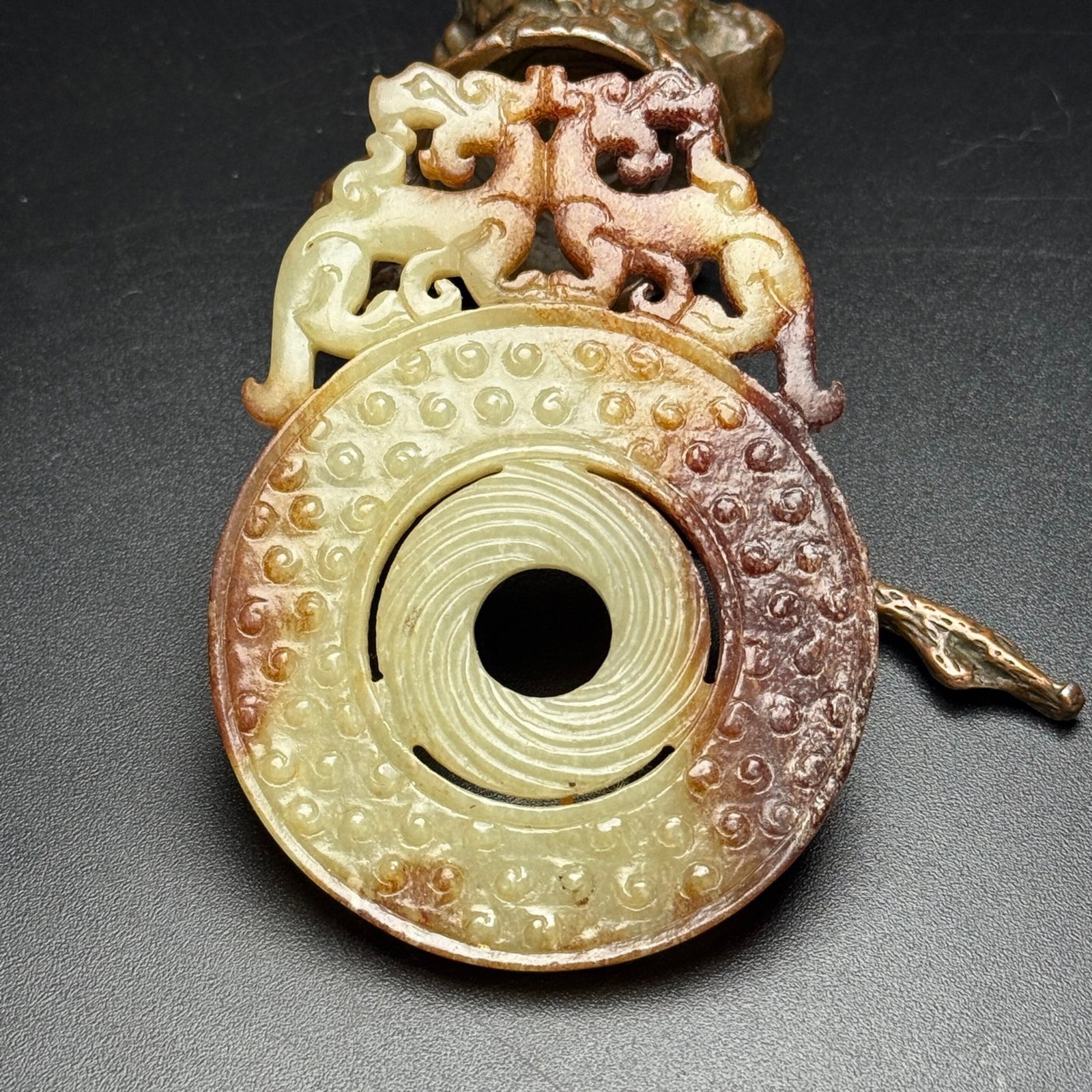 An Exquisite White Jade Auspicious Beast Pattern Pendant: Estimated Value:950-1900 An Exquisite White Jade Auspicious Beast Pattern Pendant,Qing Dynasty,China,Size:66mmx92mmx6mm,Weight:60g