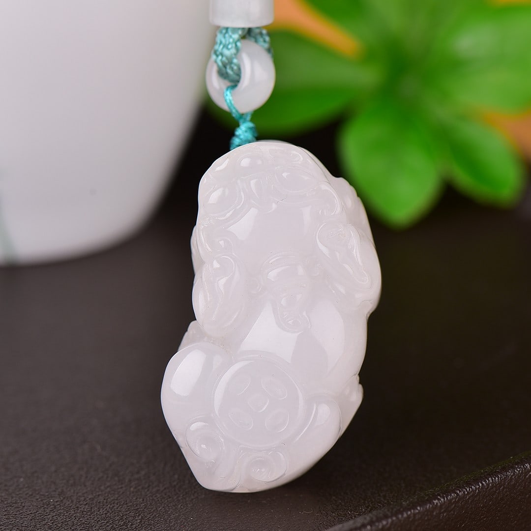 An Exquisite White Jade Auspicious Beast Pendant: Estimated Value:200-400 An Exquisite White Jade Auspicious Beast Pendant,Size:24mmx46mm