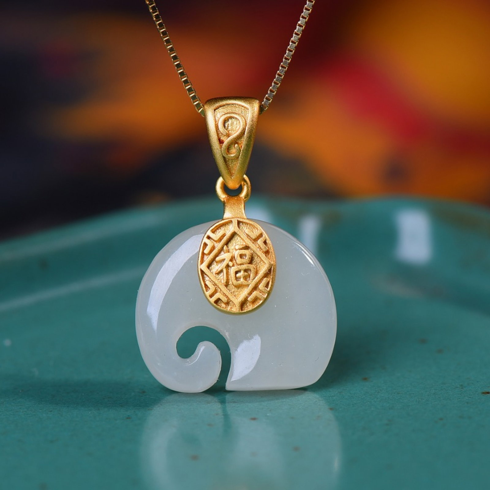 An Exquisite Sterling Silver-Gold Plated Inlaid White Jade Pendant: Estimated Value:200-400 An Exquisite Sterling Silver-Gold Plated Inlaid White Jade Pendant,Size:15mmx18mm 纯银镀金镶白玉吊坠