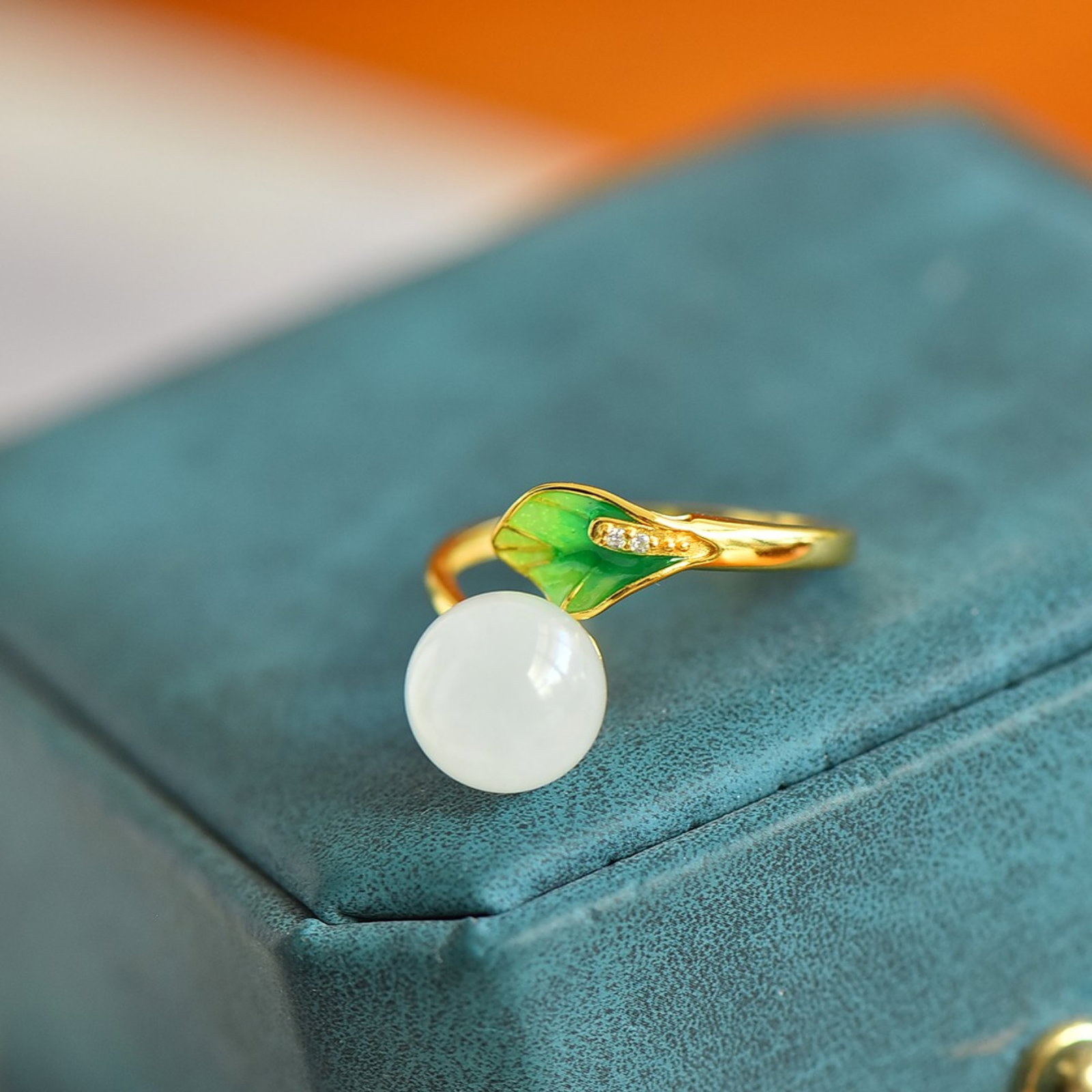 An Exquisite Sterling Silver-Gold Plated Inlaid White Jade Enamel Ring: Estimated Value:300-600 An Exquisite Sterling Silver-Gold Plated Inlaid White Jade Enamel Ring,Size:10mmx10mm 纯银镀金镶白玉珐琅戒指